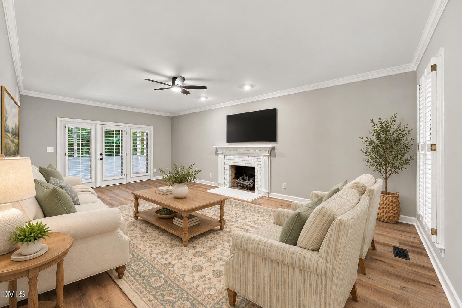 Cream sofa and sage chairs by fireplace - 6324 Hampton Ridge Road, Raleigh, NC 27603