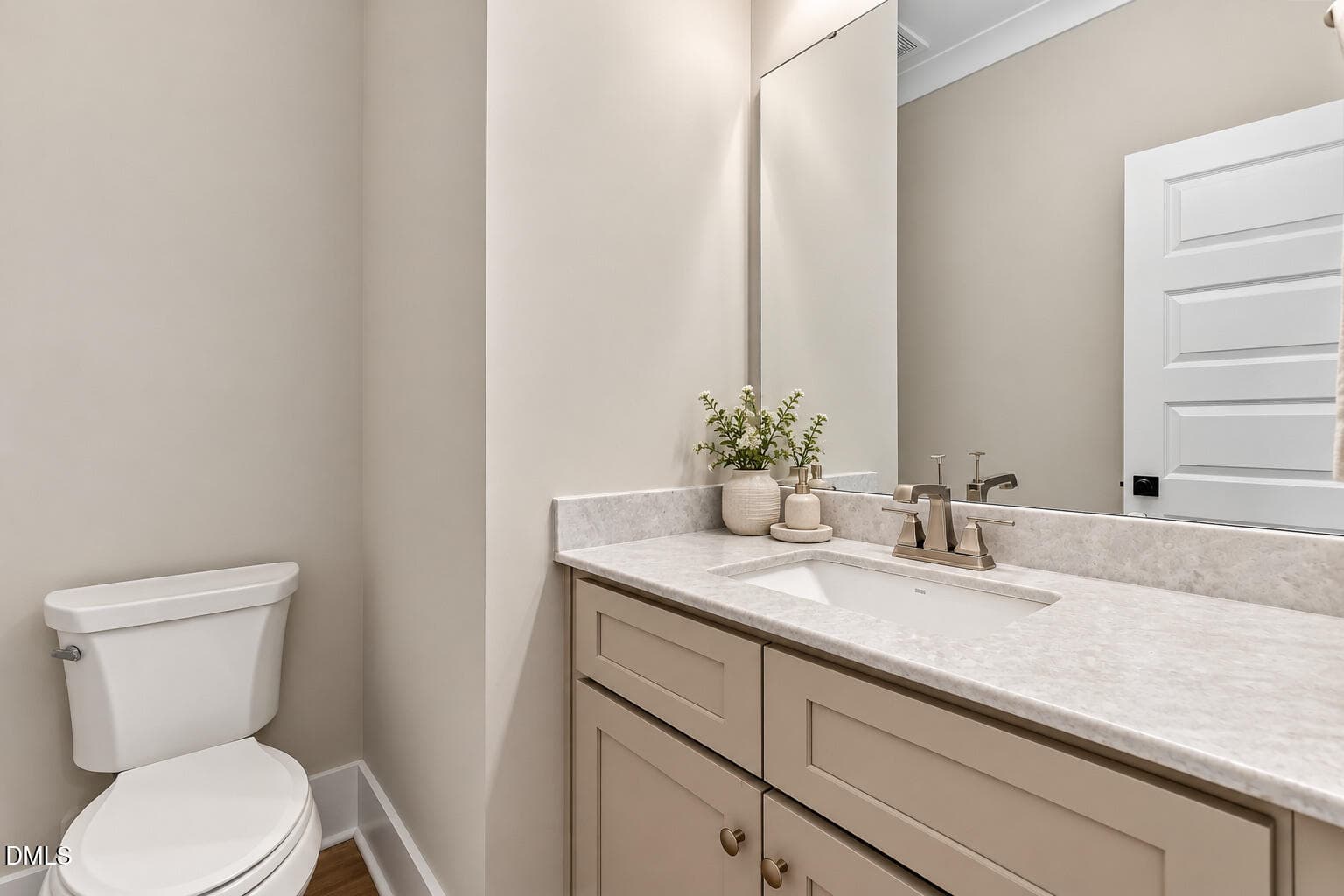 powder_room_with_flowers - 224 Lambert Lane, Fuquay Varina, NC 27526
