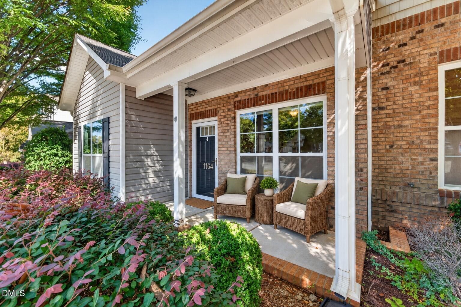 Wicker chairs on a sunlit porch - 1164 Kelso Lane, Burlington, NC 27215, Burlington