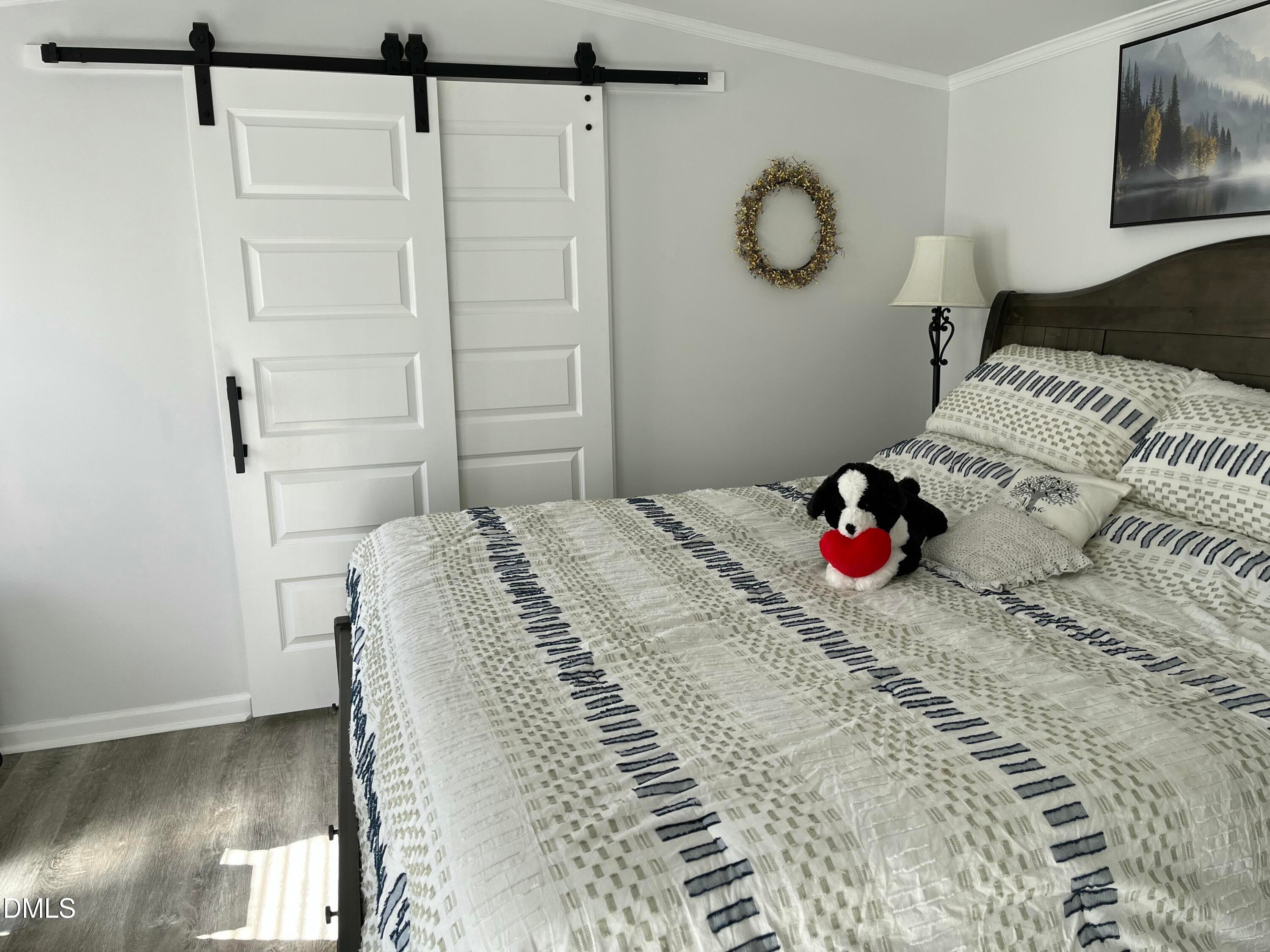 Barn door leads to prive en suite bath - 49 Hibernia Cove Loop, Henderson, NC 27537, Henderson