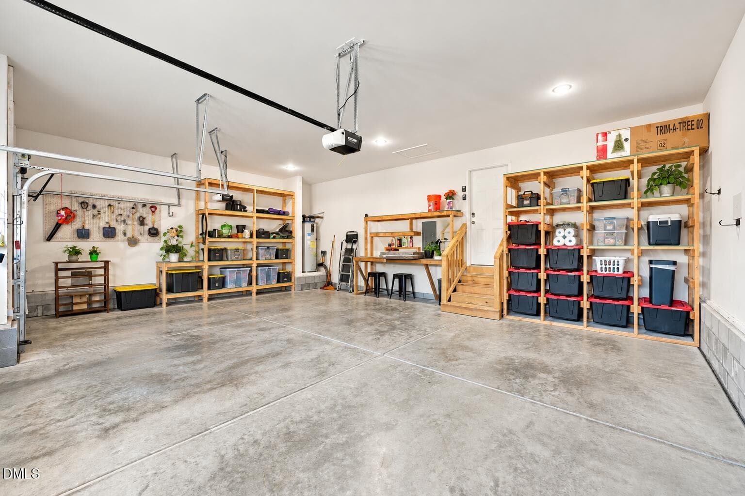 Bright Organized Three-Car Garage - 250 Mahogany Way, Four Oaks, NC 27524