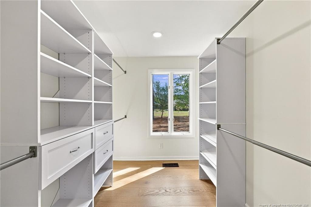 walk in closet in primary bedroom - 84 Richmond Road, Jackson Springs, NC 27281