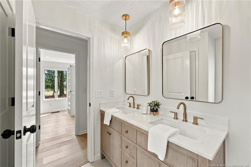 primary bath with double sinks - 84 Richmond Road, Jackson Springs, NC 27281
