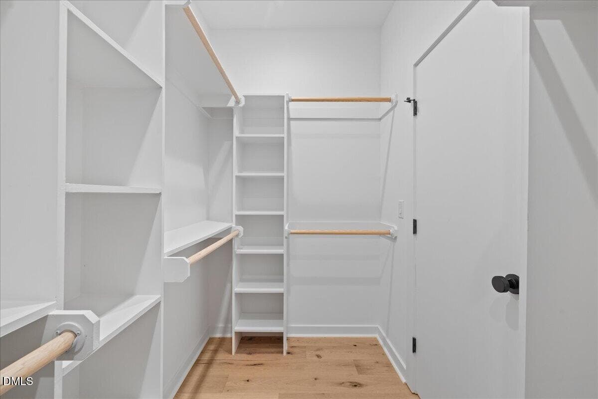 Large primary walk-in closet - 804 Cotton Place 102, Raleigh, NC 27601