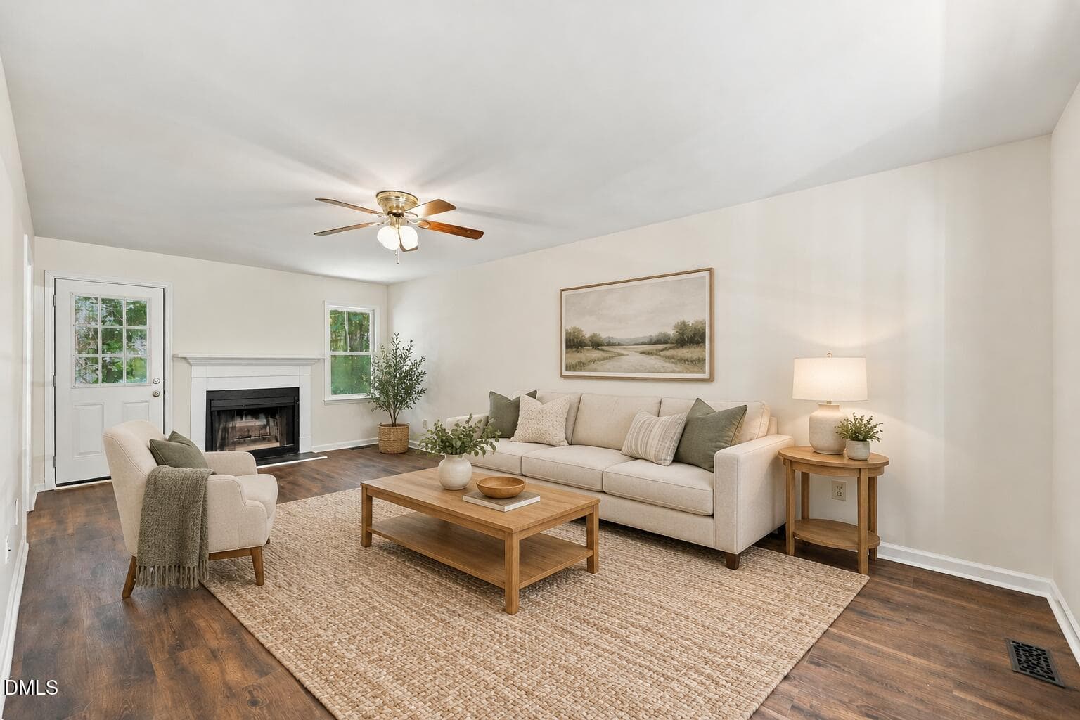 Airy living room with beige sofa - 5140 Simmons Branch Trail, Raleigh, NC 27606