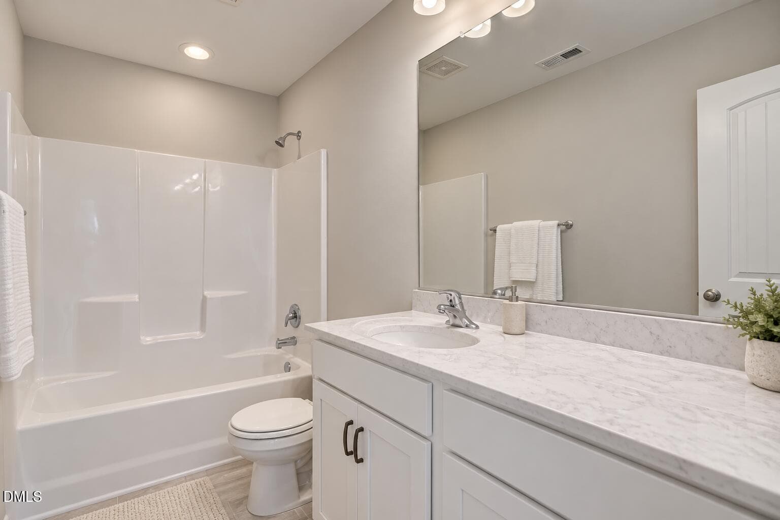 Daylit Hall Bathroom with White Vanity-1 - 224 Starlet Ridge Way, Clayton, NC 27520