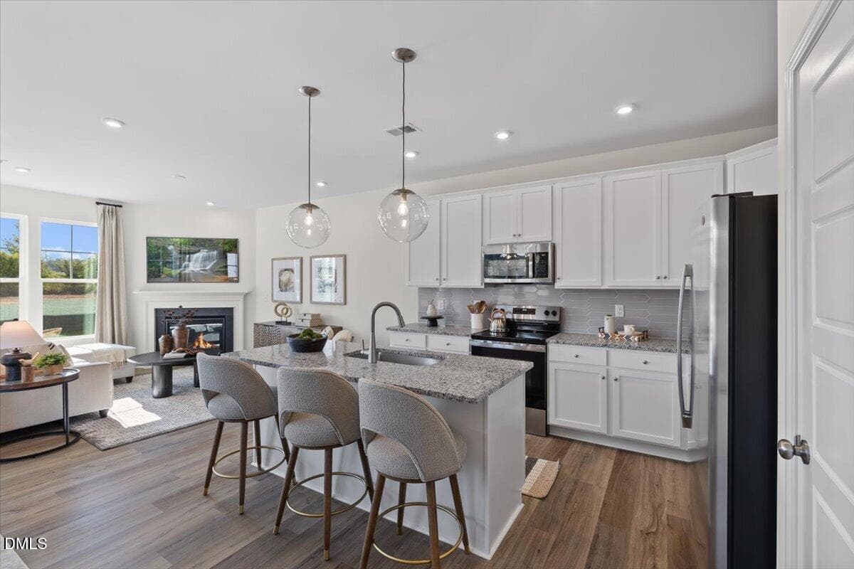14-hhhunt-homes-whitfield-kitchen-living - 107 Rolesville Ridge Drive, Rolesville, NC 27571