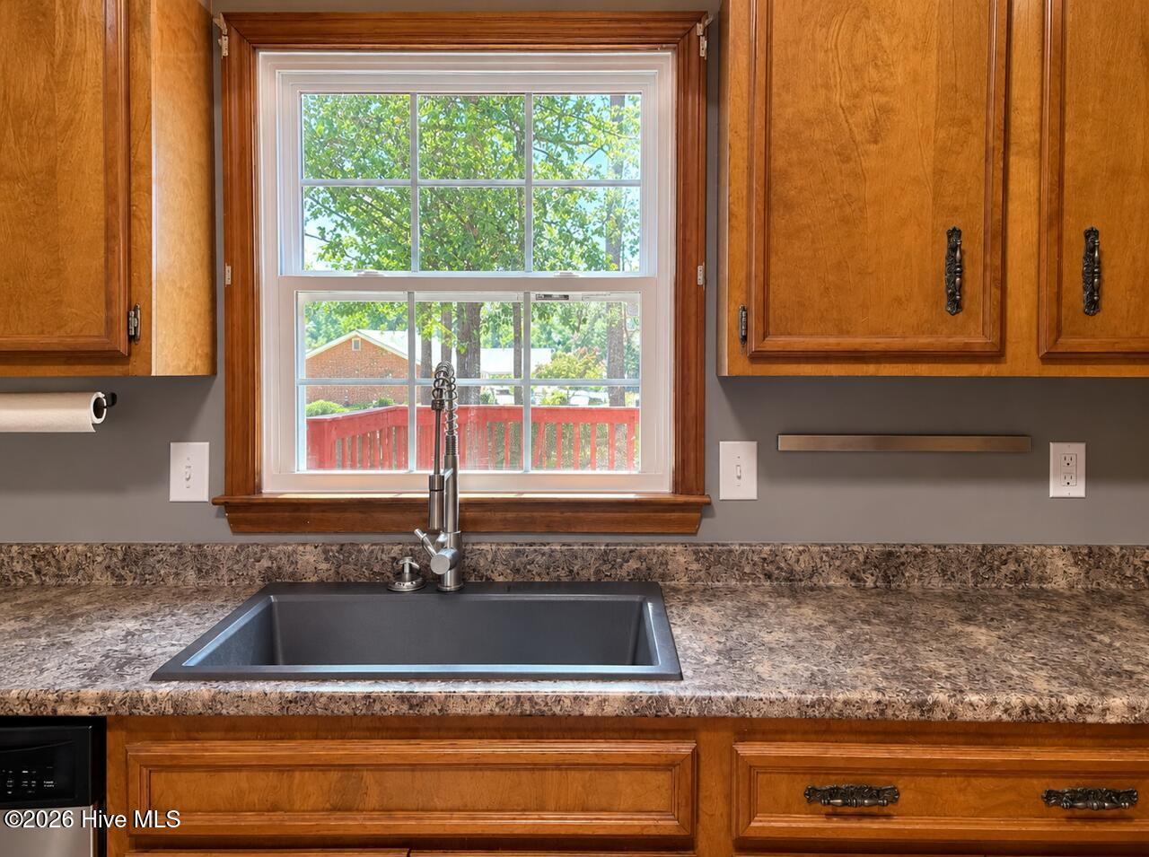 Wonderful farmhouse style sink! Nice view of the backyard from sunny window. - 4164 Quail Springs Circle, Augusta, GA 30907