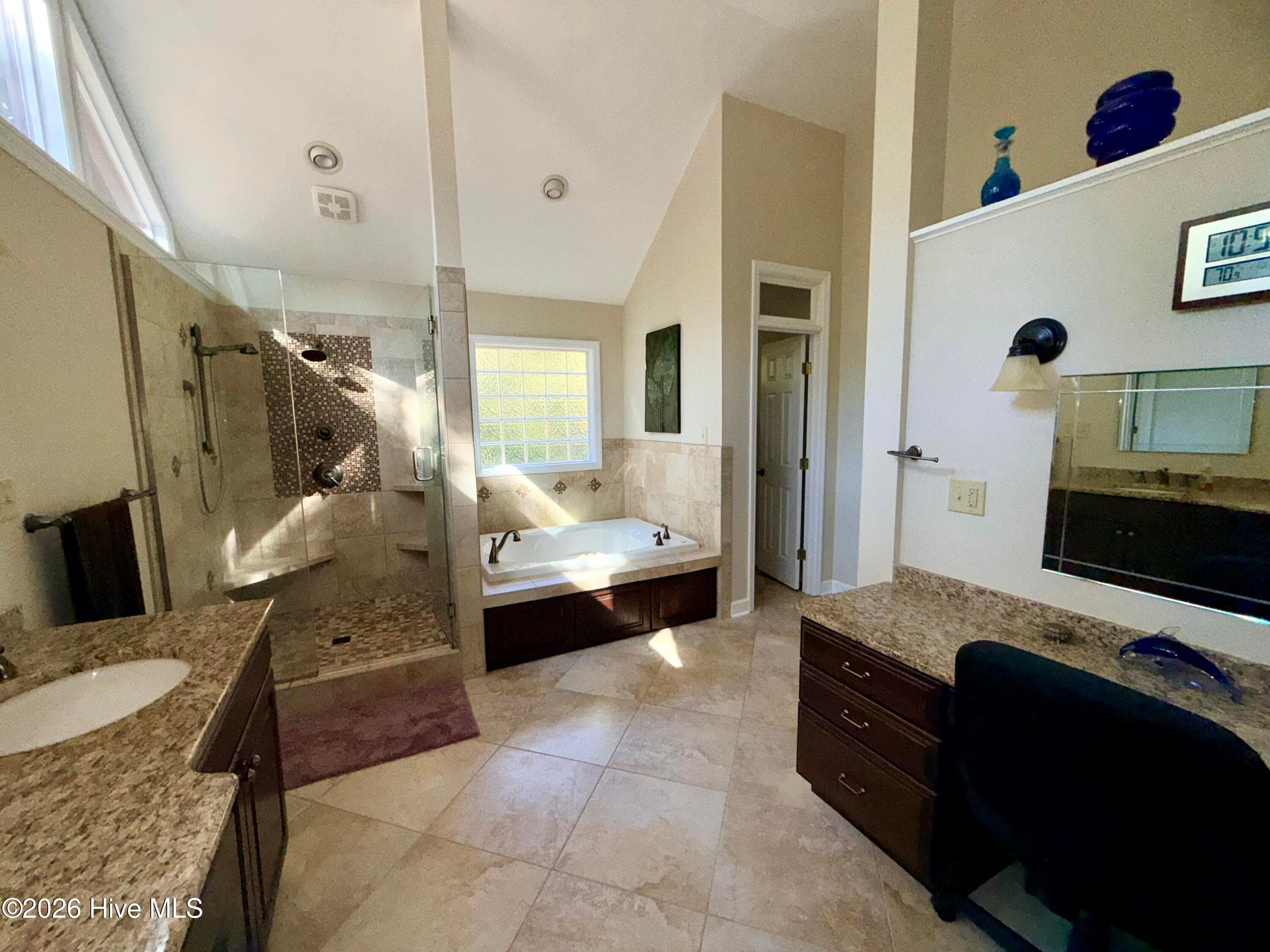 master bath with vanity, double sinks, whirlpool tub and walk in shower - 12681 Blues Farm Road, Laurinburg, NC 28352