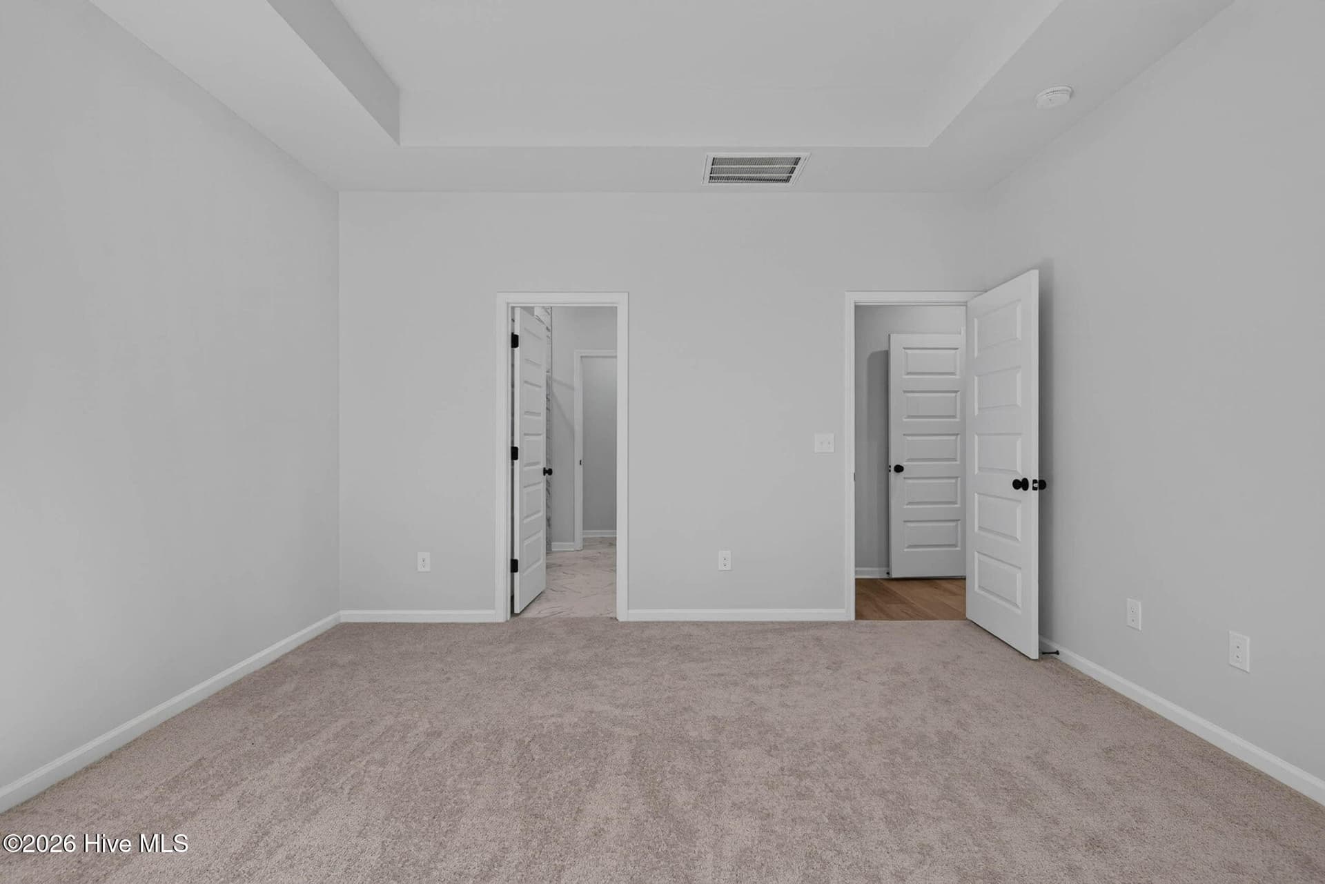 Another view of the main-level primary suite, offering a flexible layout and convenient first-floor living. - 3447 Sandhill Crane Drive SW, Ocean Isle Beach, NC 28469
