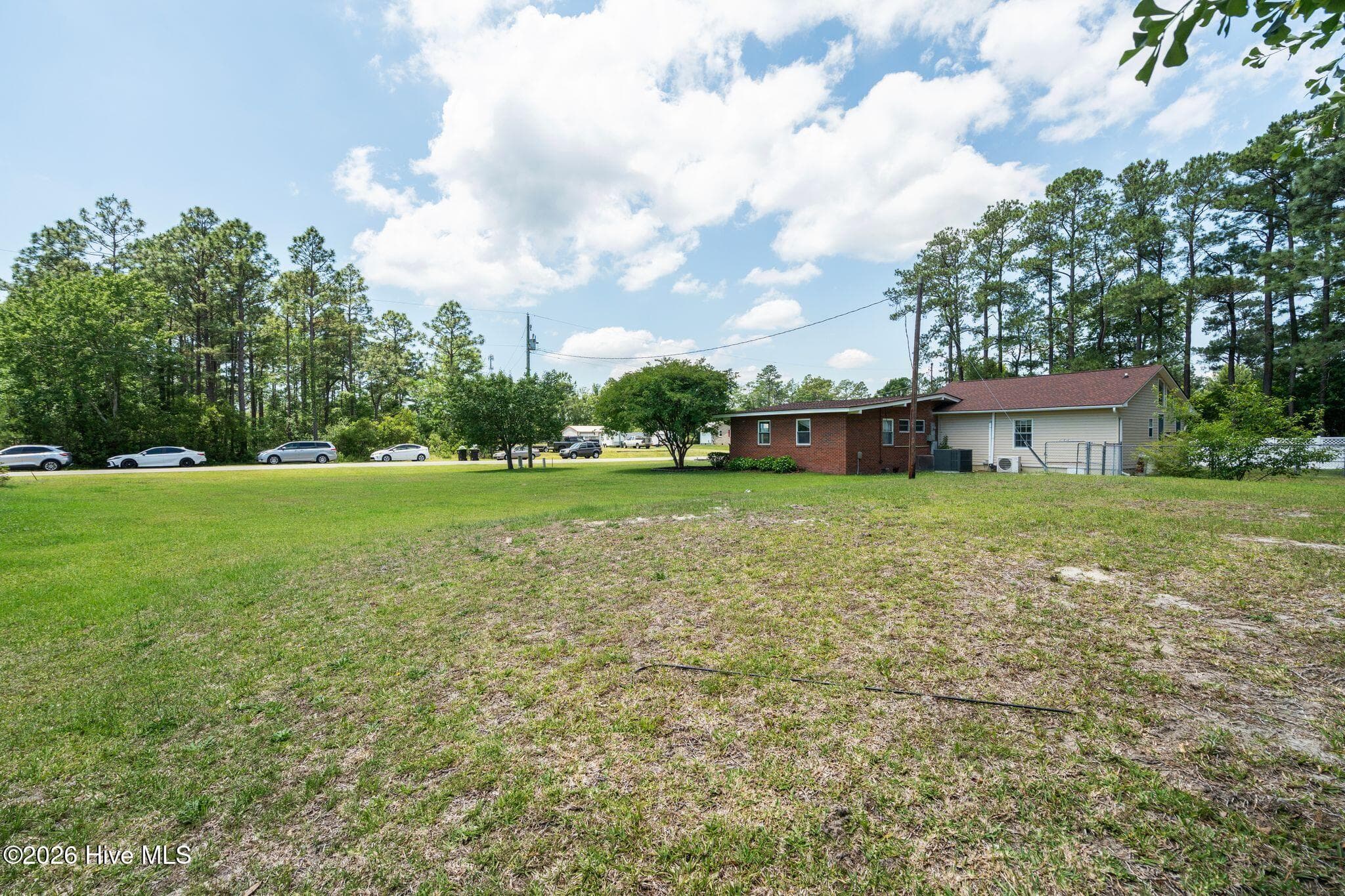 SIDE YARD looking toward Main House - 113 Willetts Drive, Boiling Spring Lakes, NC 28461