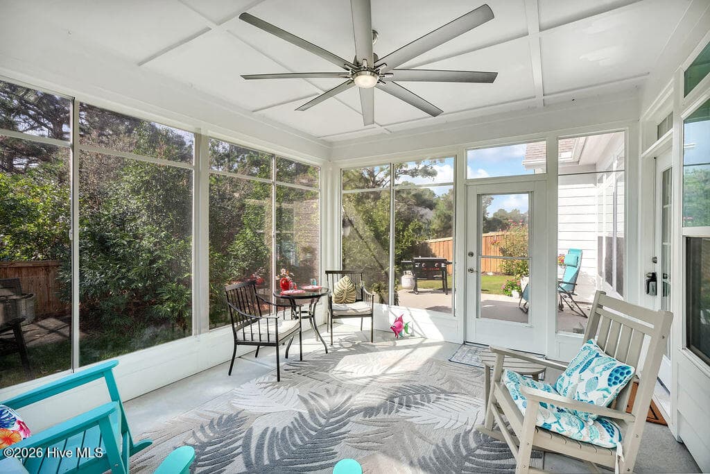 Take advantage of Wilmington’s greatest amenity, outdoor living, as you enjoy months of relaxation in the roomy enclosed 3-seasons room overlooking beautiful custom landscaping. - 142 Rice Marsh Way, Wilmington, NC 28412