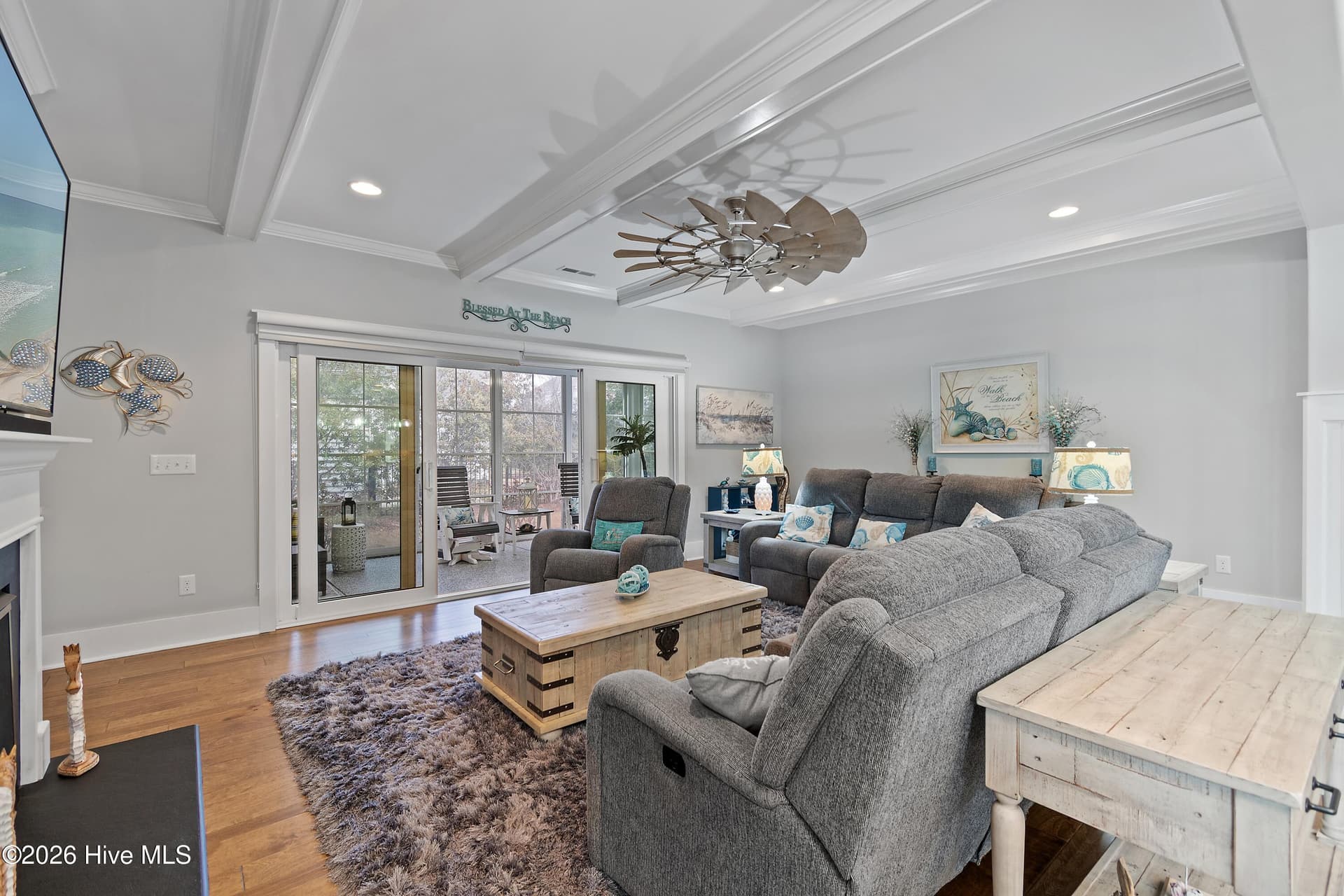 Doors to EZ Breeze sunroom slide open to create an indoor/outdoor feel. - 6358 Bryson Drive SW, Ocean Isle Beach, NC 28469