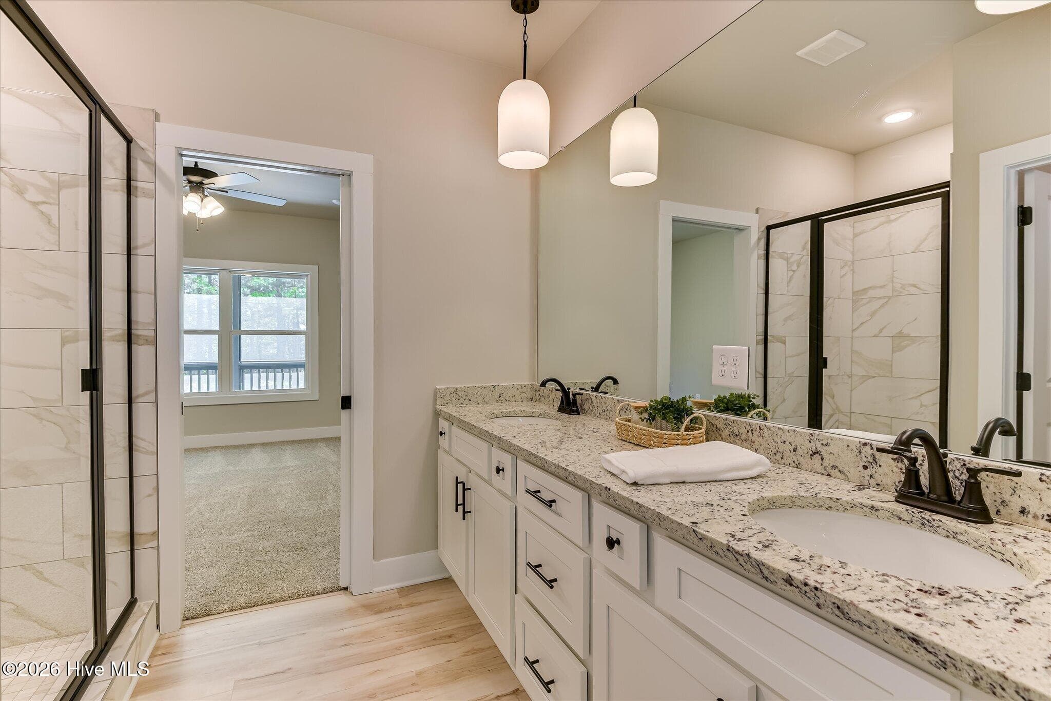 Primary Ensuite with double-sink vanity, tile shower, large walk-in closet - 1198 Sunset Cove, Tignall, GA 30668