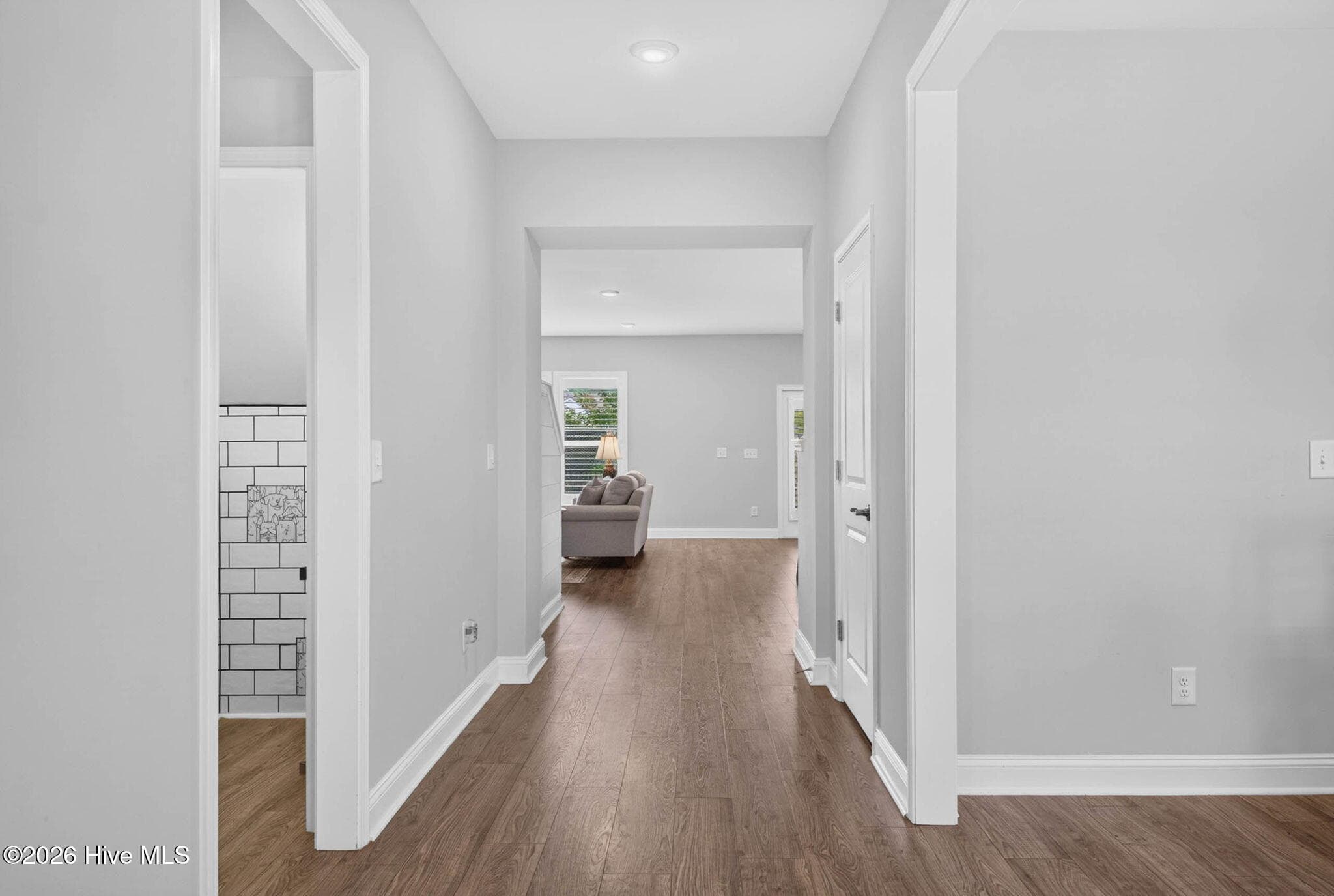 The bright entrance foyer welcomes you inside with high ceilings, luxury vinyl plank flooring, and an open layout. - 139 Eagle Claw Drive, Calabash, NC 28467