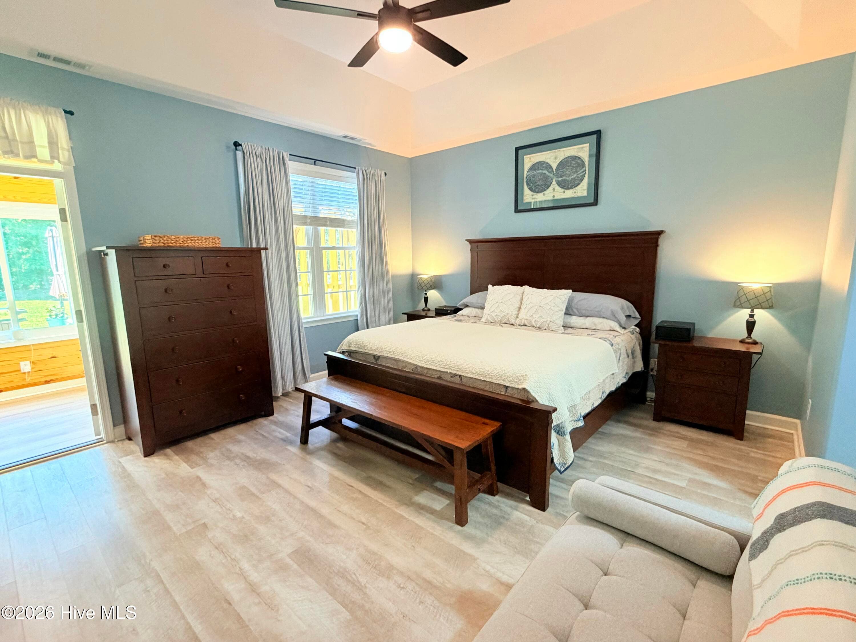 primary bedroom with door to new addition room - 1926 Snowy Egret Drive, Morehead City, NC 28557
