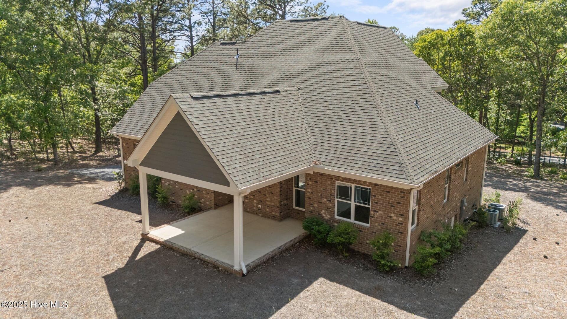 Rear of property with porch/patio - 225 Lakeway Drive, West End, NC 27376