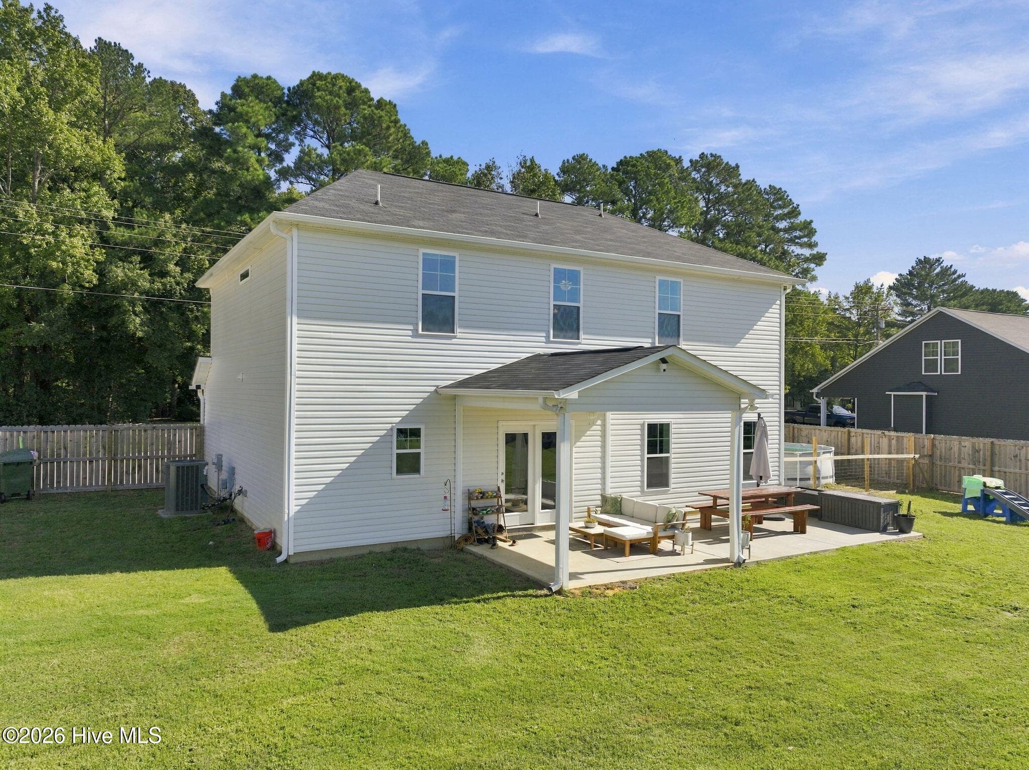 Covered back patio, with room to the side for additional seating / relaxing - 1400 Chason Road, Lumber Bridge, NC 28357