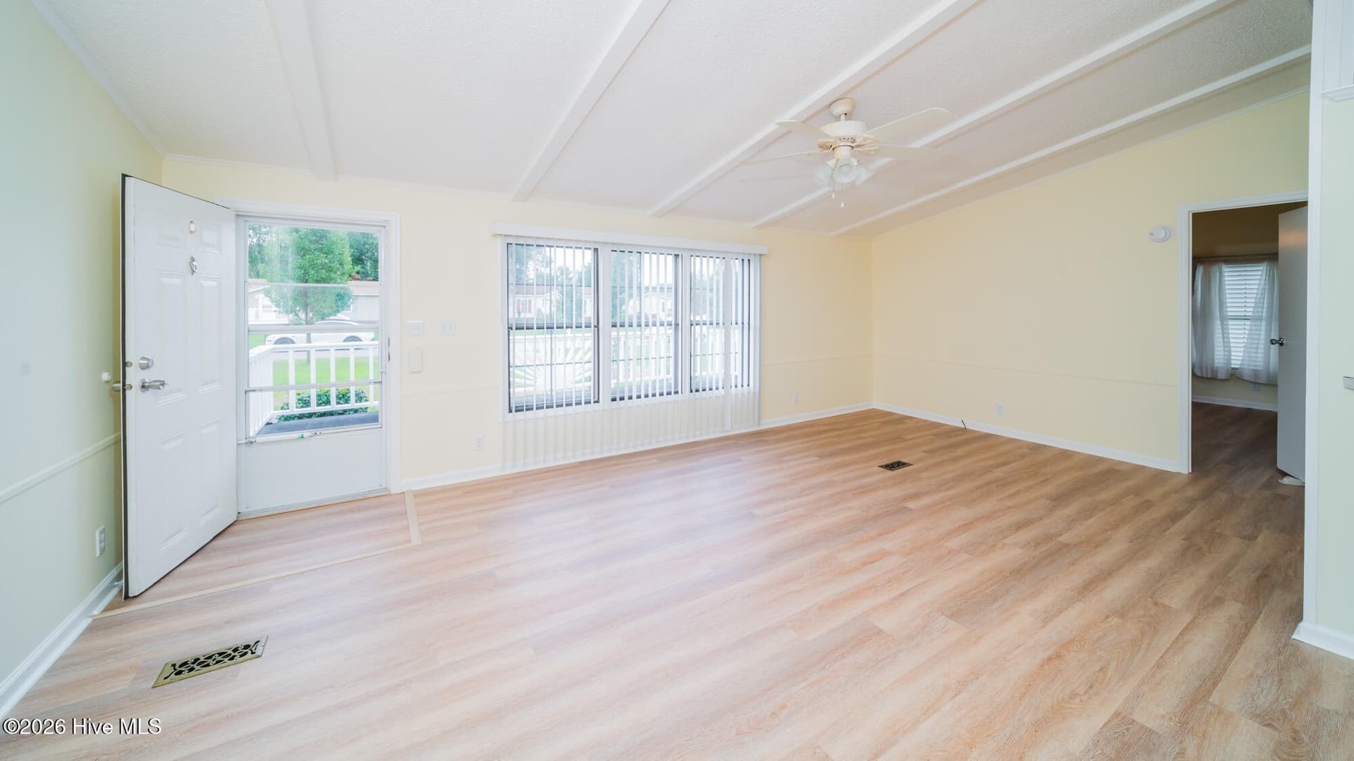 The great room boast of LVP, vaulted ceilings and plenty of sunlight. - 1076 Clubview Lane SW, Calabash, NC 28467
