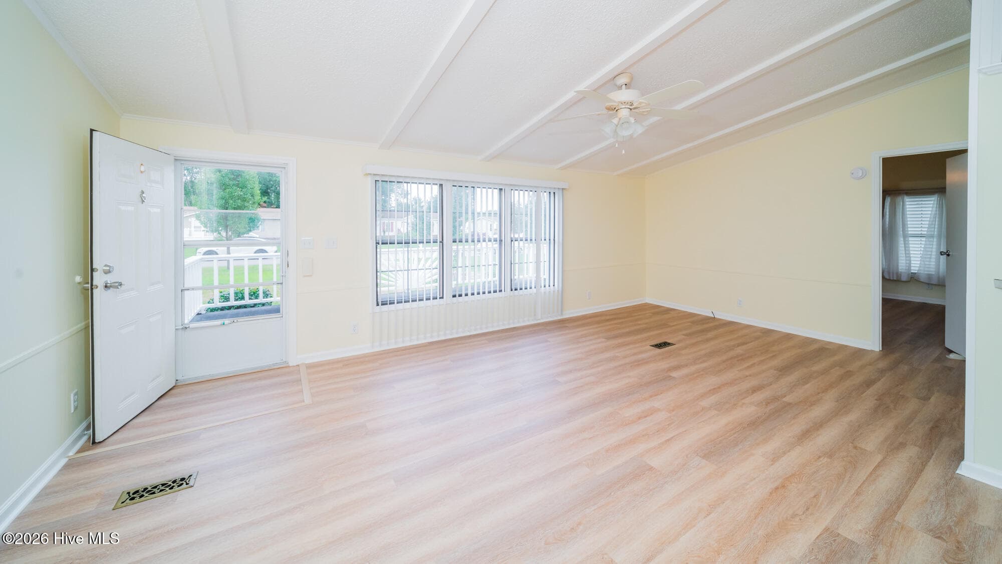 The great room boast of LVP, vaulted ceilings and plenty of sunlight. - 1076 Clubview Lane SW, Calabash, NC 28467