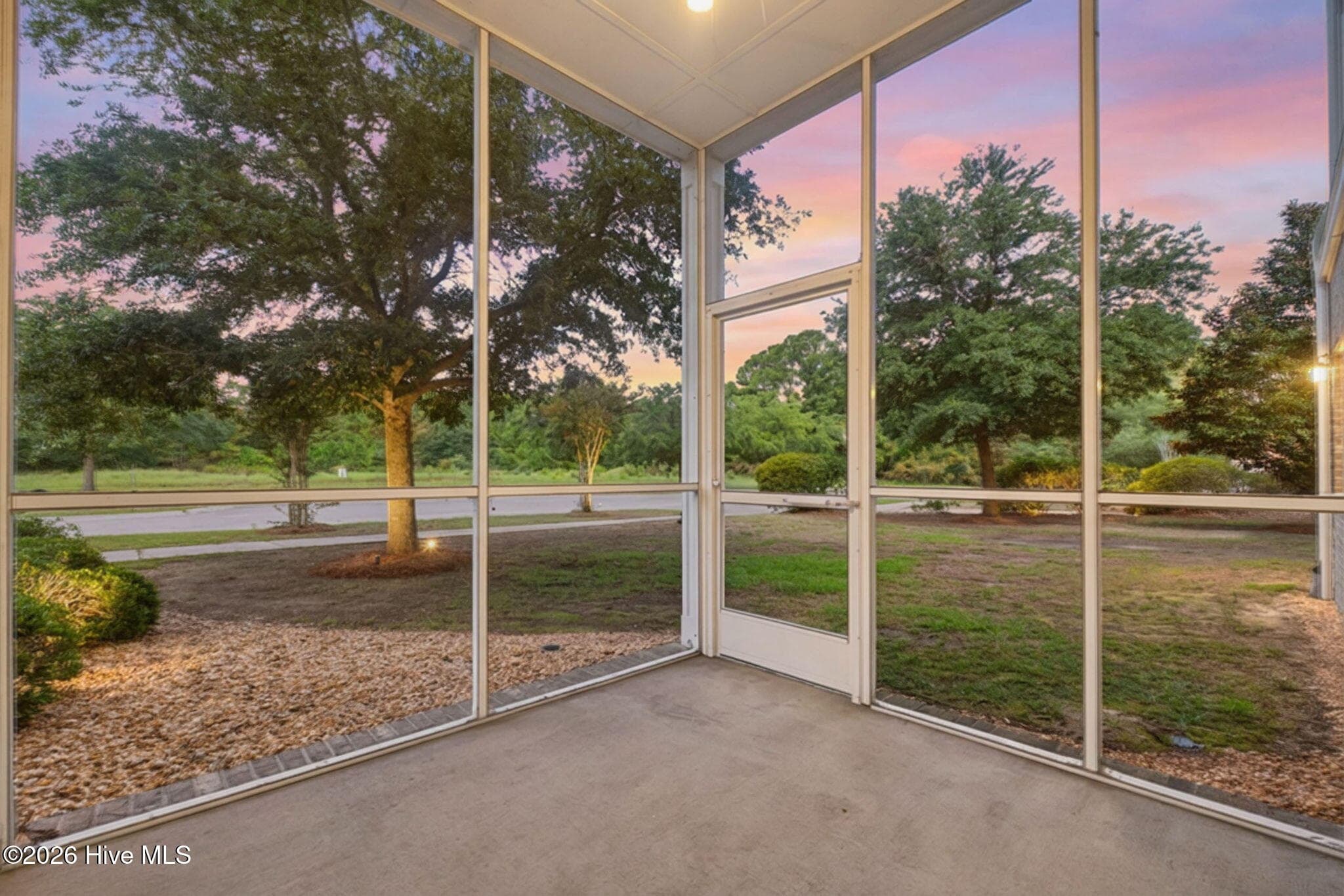 Screened-in porch off of living room - 7825 High Market Street #303, Sunset Beach, NC 28468