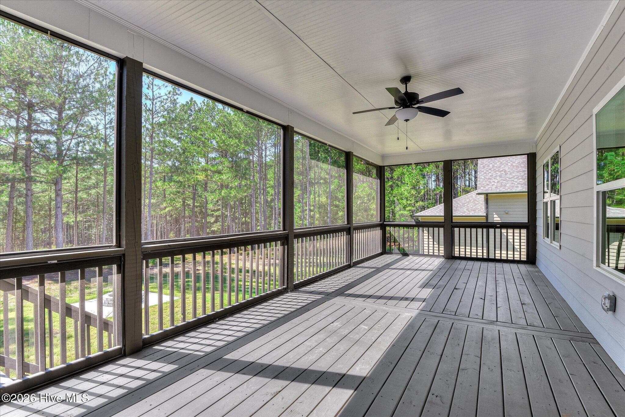 Screened porch stretches across the back of the home. - 1198 Sunset Cove, Tignall, GA 30668
