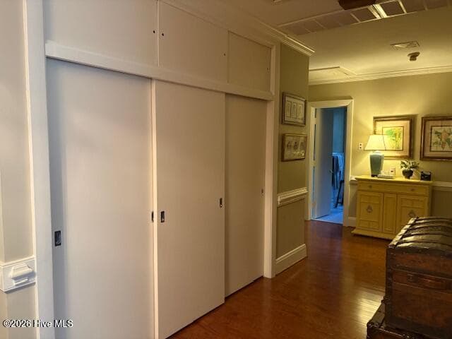 hall closet definitely has the mid centry vibe utilizing space to the ceiling - sliding wood doors - 104 Bunn Avenue, Rocky Mount, NC 27804