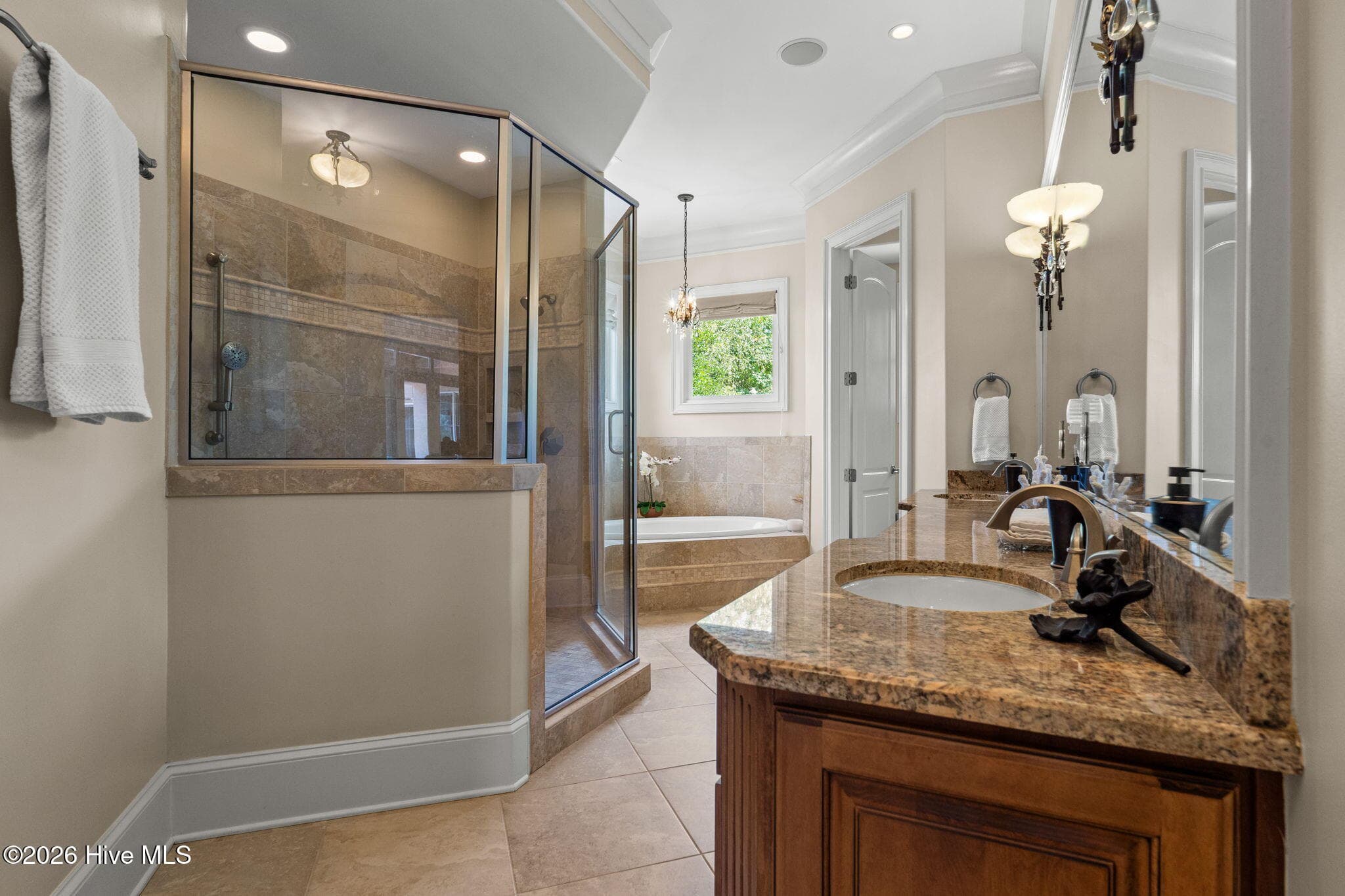 Primary bath with double sinks, granite counters, shower and jacuzzi tub - 3858 Ridge Crest Drive, Southport, NC 28461