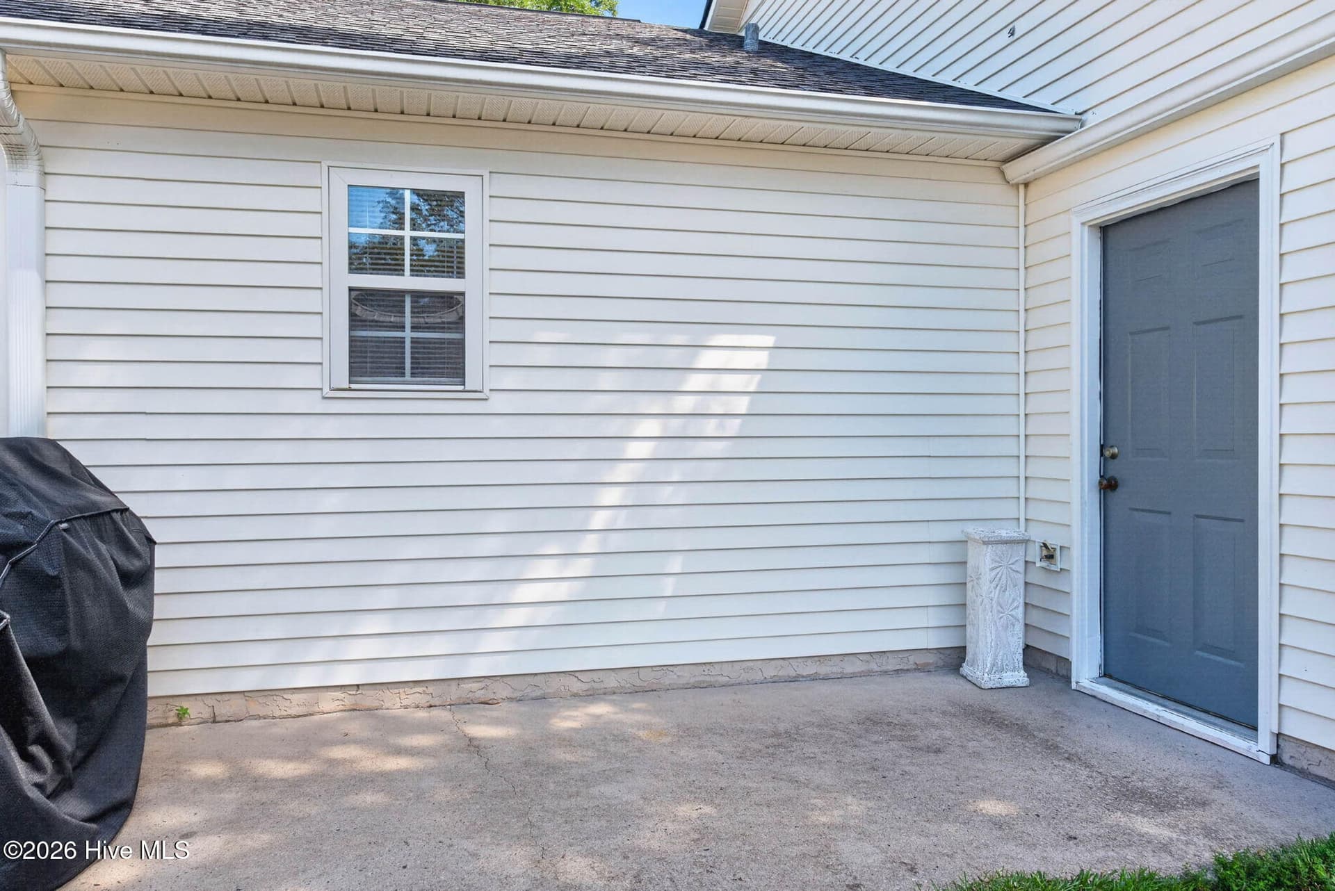 Additional patio space extends the home's outdoor living and offers a convenient spot for grilling and entertaining. - 1650 Frink Street SW, Ocean Isle Beach, NC 28469