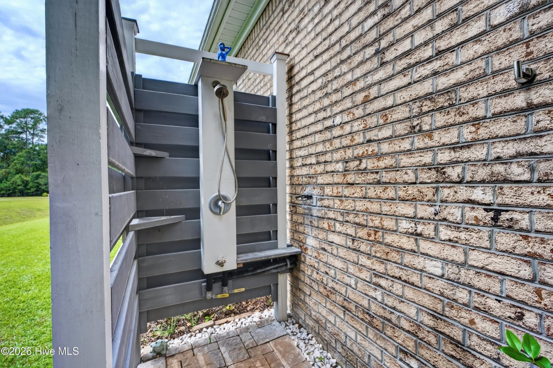 outdoor shower with hot and cold water - 101 Beaumont Circle, Hampstead, NC 28443