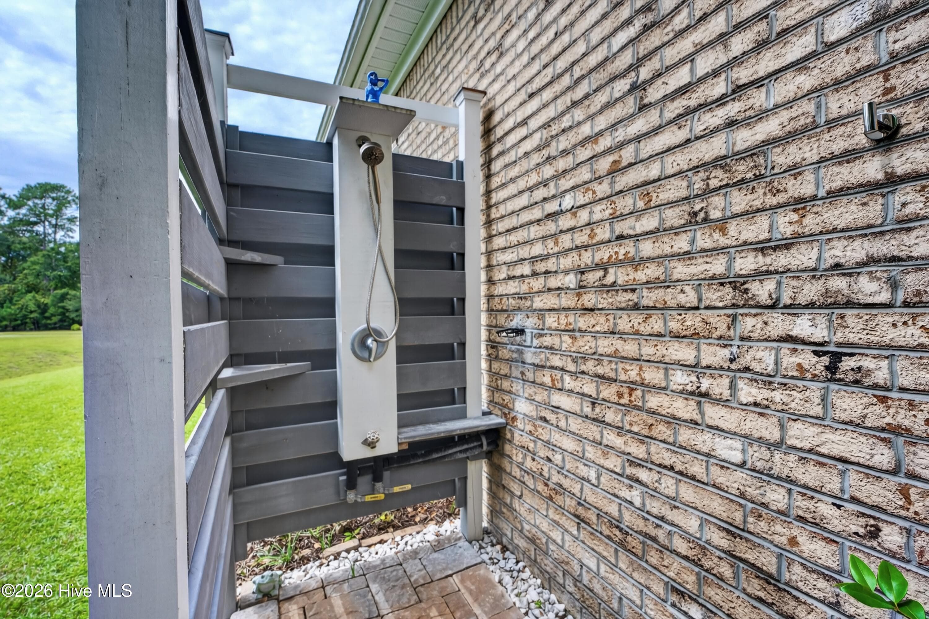 outdoor shower with hot and cold water - 101 Beaumont Circle, Hampstead, NC 28443