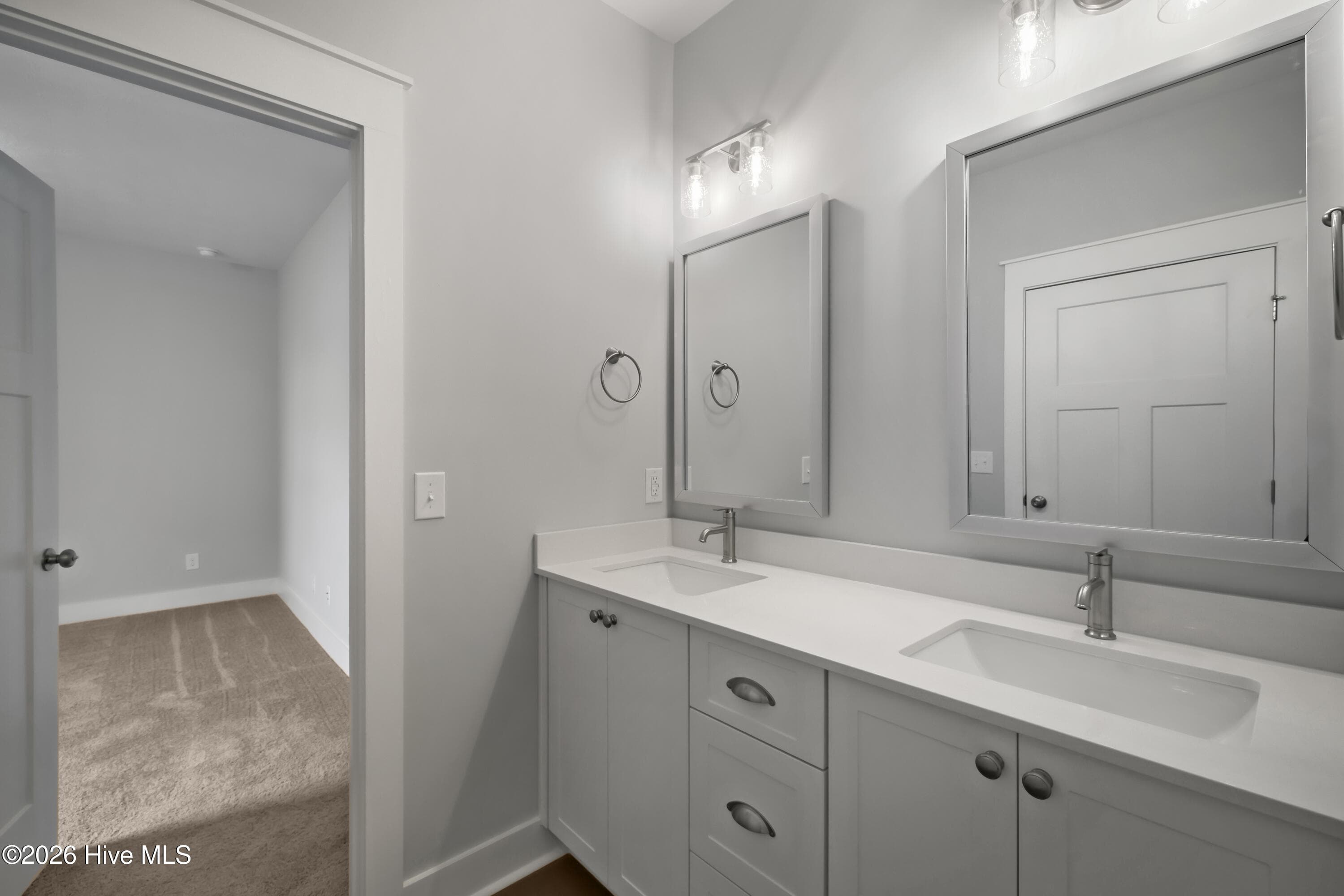 guest bathroom with dual sinks and quartz counter-tops - 1777 Bellingham Drive, Beech Island, SC 29842