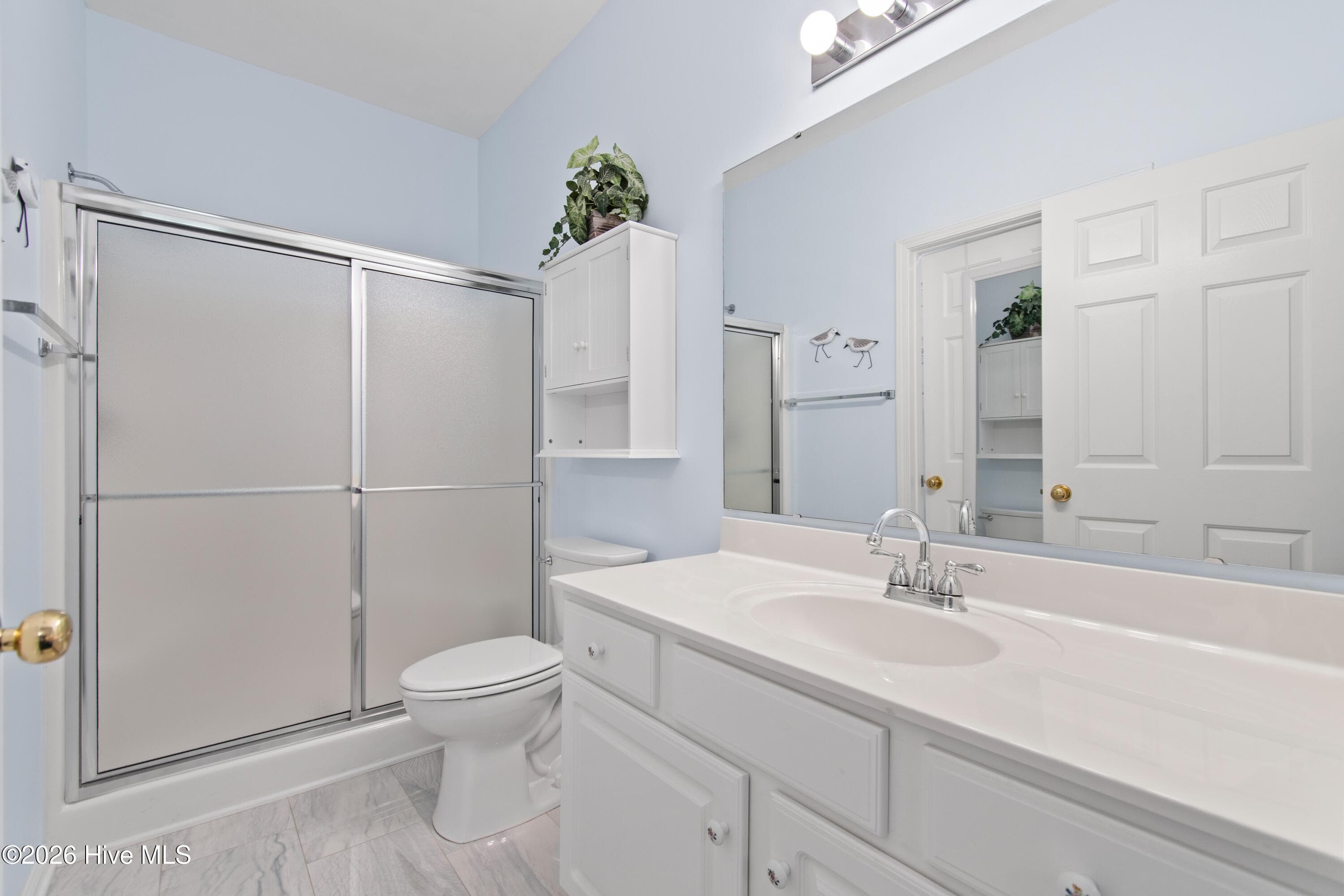 Primary suite bath with walk in shower - 940 Great Egret Circle SW # 2, Sunset Beach, NC 28468