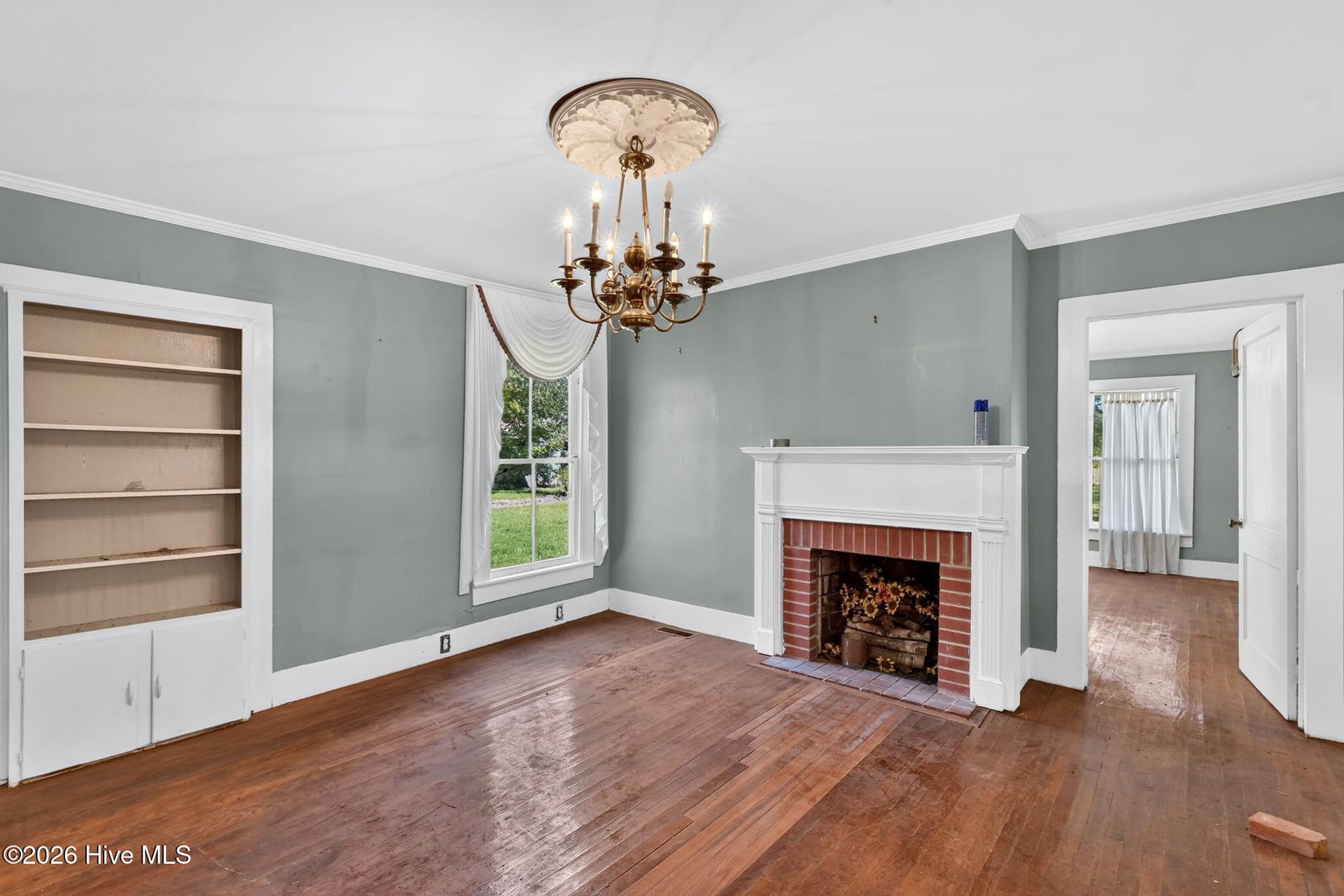 Family Room looking towards the fireplace and front right bedroom - 436 Doctor Robinson Road, Bladenboro, NC 28320