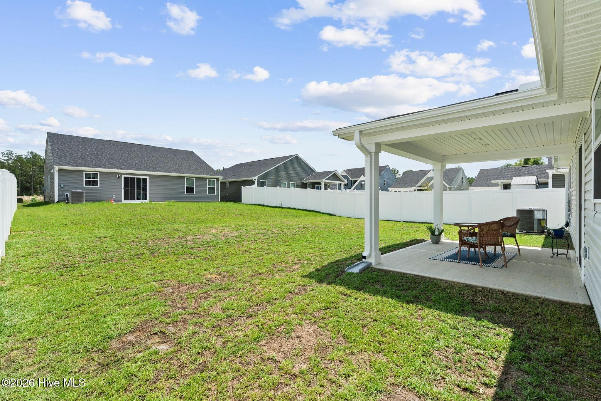 BACK YARD AND COVERED BACK PORCH - 967 Rindlewood Trail NE, Bolivia, NC 28422