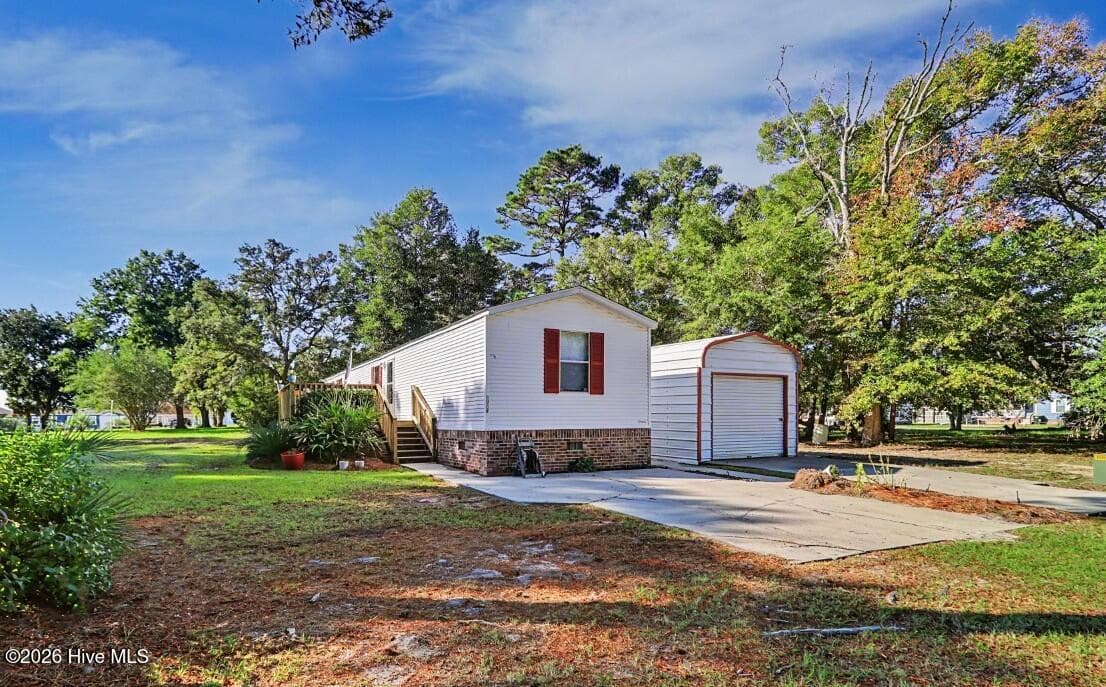 Manufactured Home at 3215 Herthwood Place SW, Supply, NC 28462, photo 2 of 36