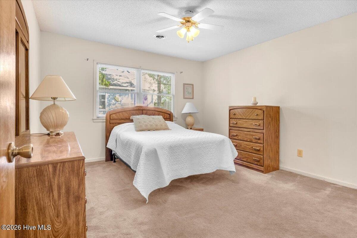 Primary Bedroom. 1/2 bath attached - 109 NE 30th Street, Oak Island, NC 28465