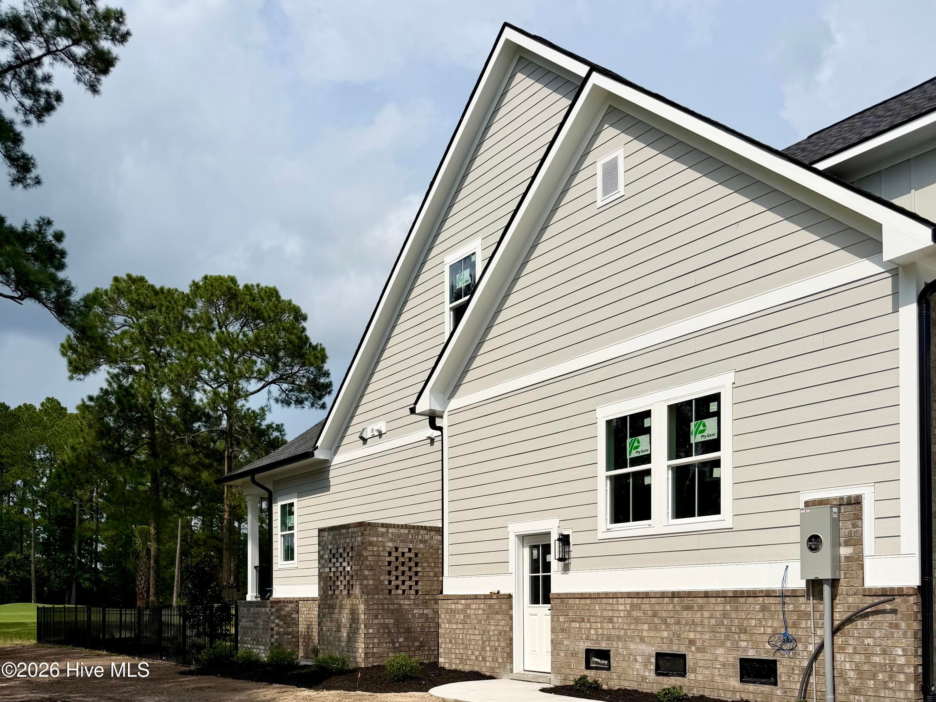 Side view, under construction. - 550 Glenburnie Street NW, Calabash, NC 28467