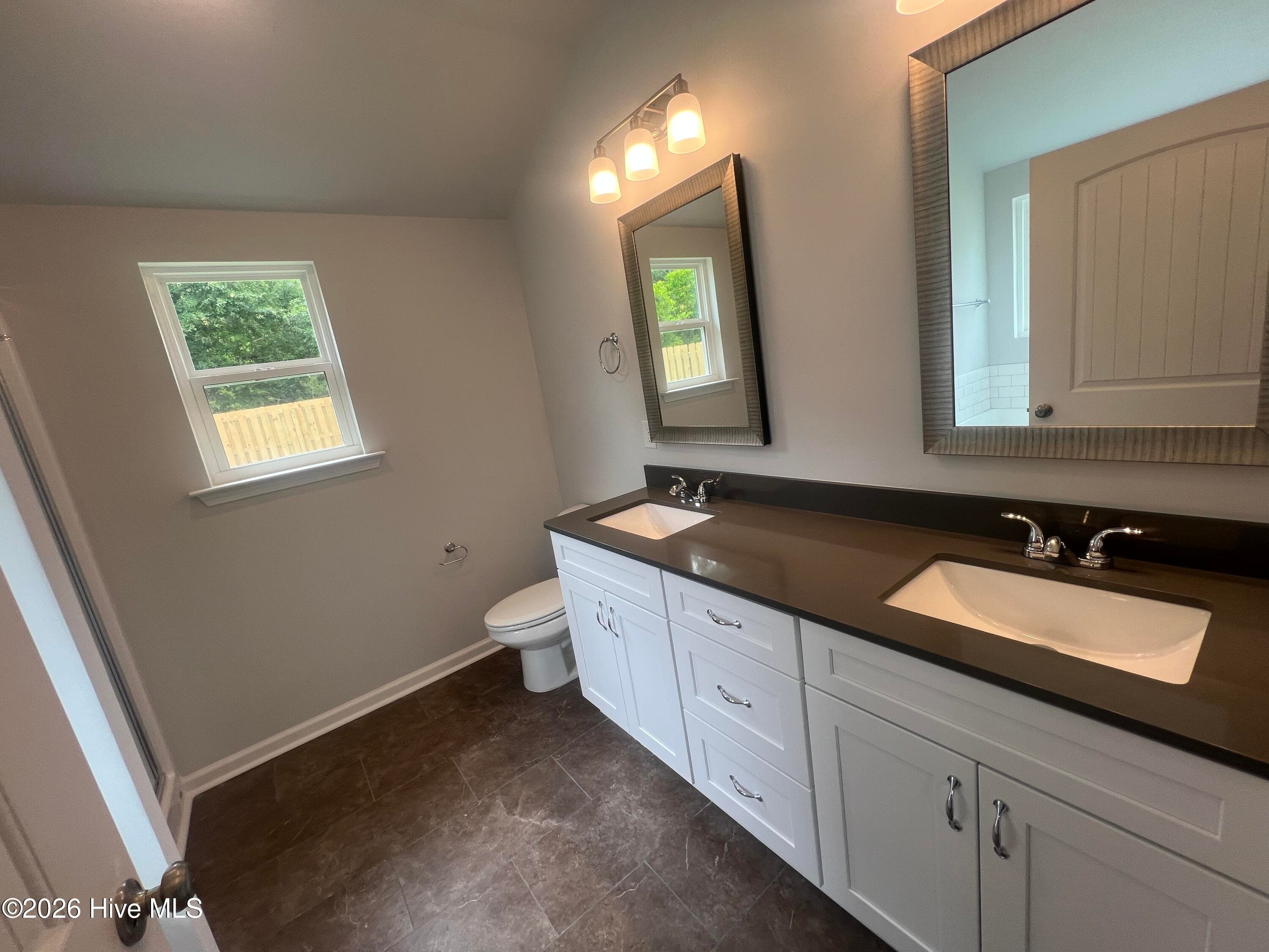 En suite bath features dual vanities. - 8887 Snelling Drive, Aiken, SC 29803