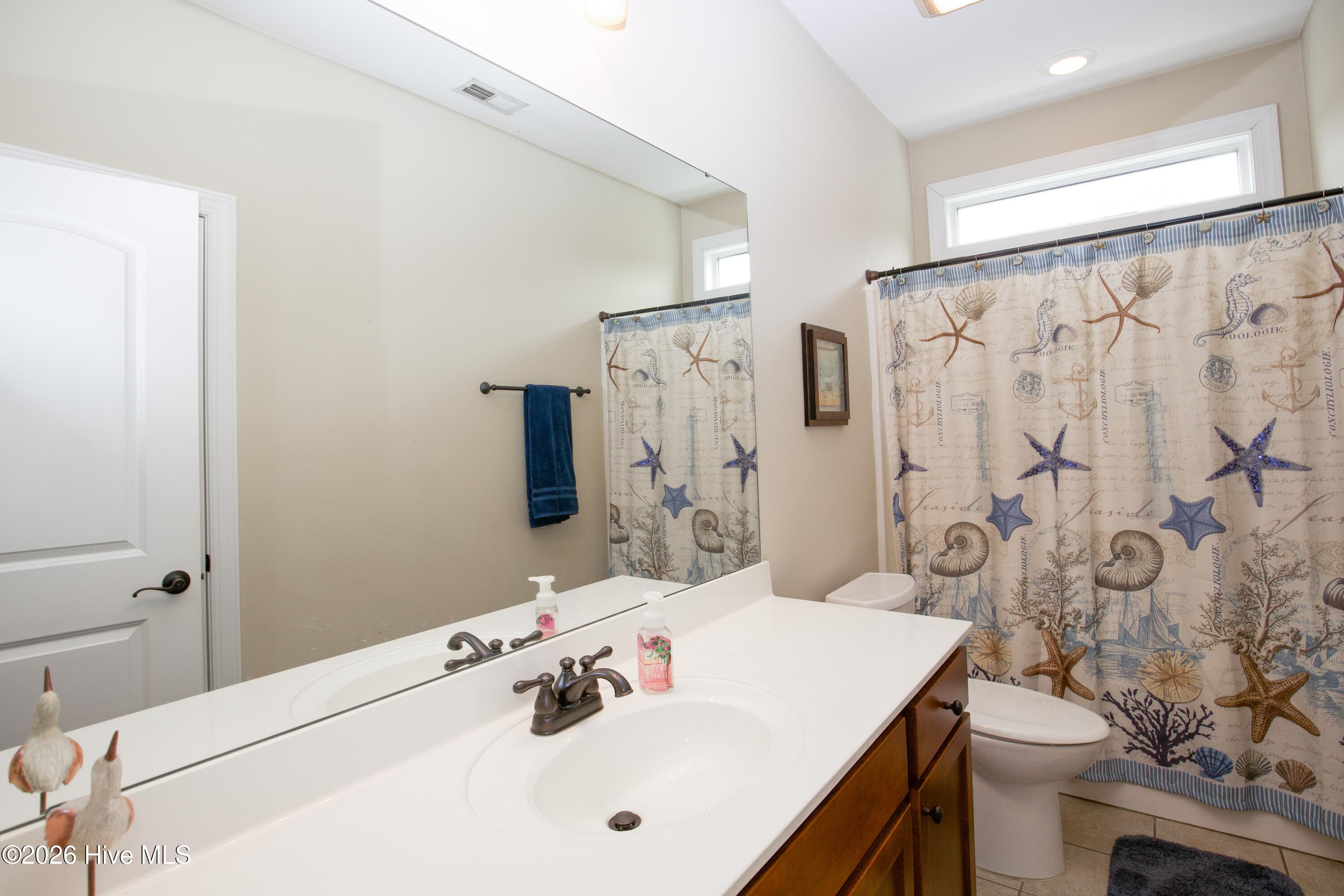 Main-level hall bathroom. - 899 Seagull Drive, Vass, NC 28394, Vass