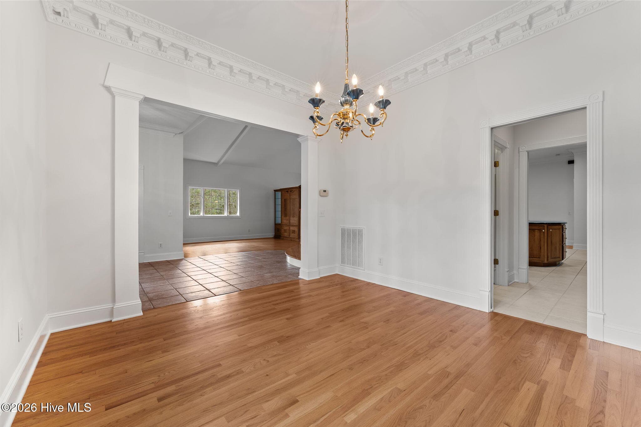Front right corner of dining room with door access to a very large walk in pantry and prep are. Can be closed off by a pocket door for a more intimate setting. - 22 Lochmere Drive, Pinehurst, NC 28374