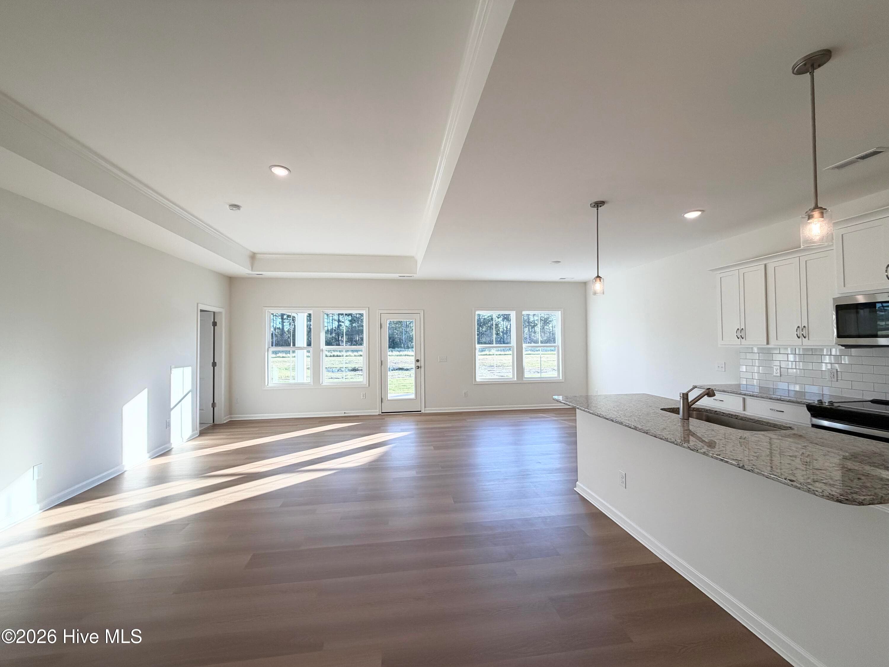 Home shown is a representation of the floor plan and may include optional features or upgrades. Elevations, materials, colors, - 758 Pelican Cv Way SE 298, Southport, NC 28461