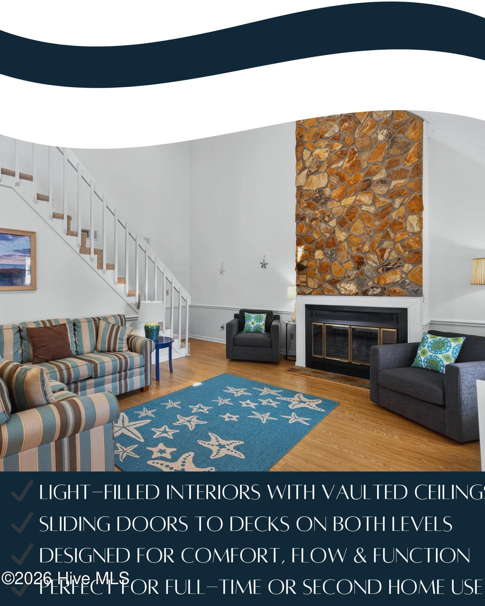 Bright and airy living room with vaulted ceilings, coastal décor, and wood-burning fireplace. - 1206 N Shore Drive W, Sunset Beach, NC 28468