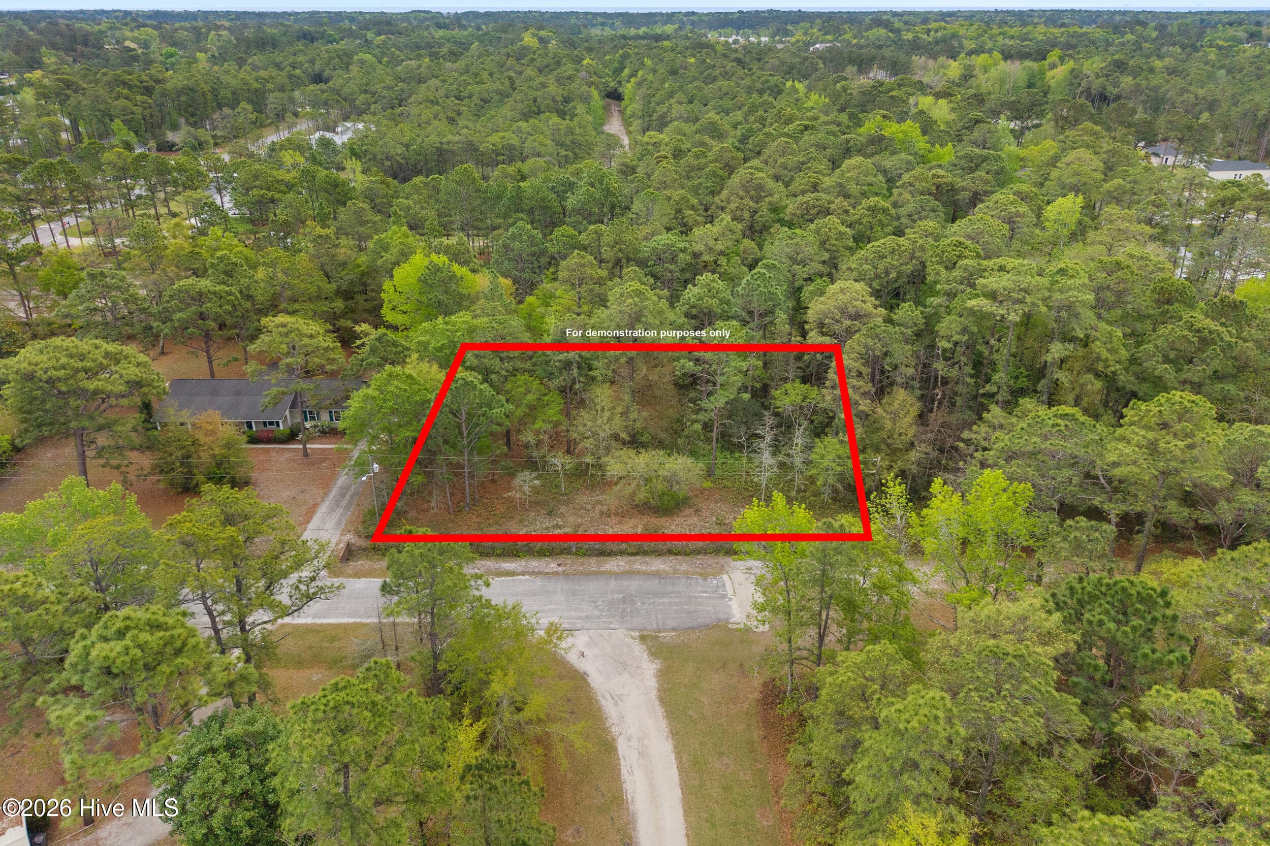 Lot size is about 125 feet by about 200 feet. Red lines are for demonstation purposes only - 3 3 Deer Run Road SW, Carolina Shores, NC 28467
