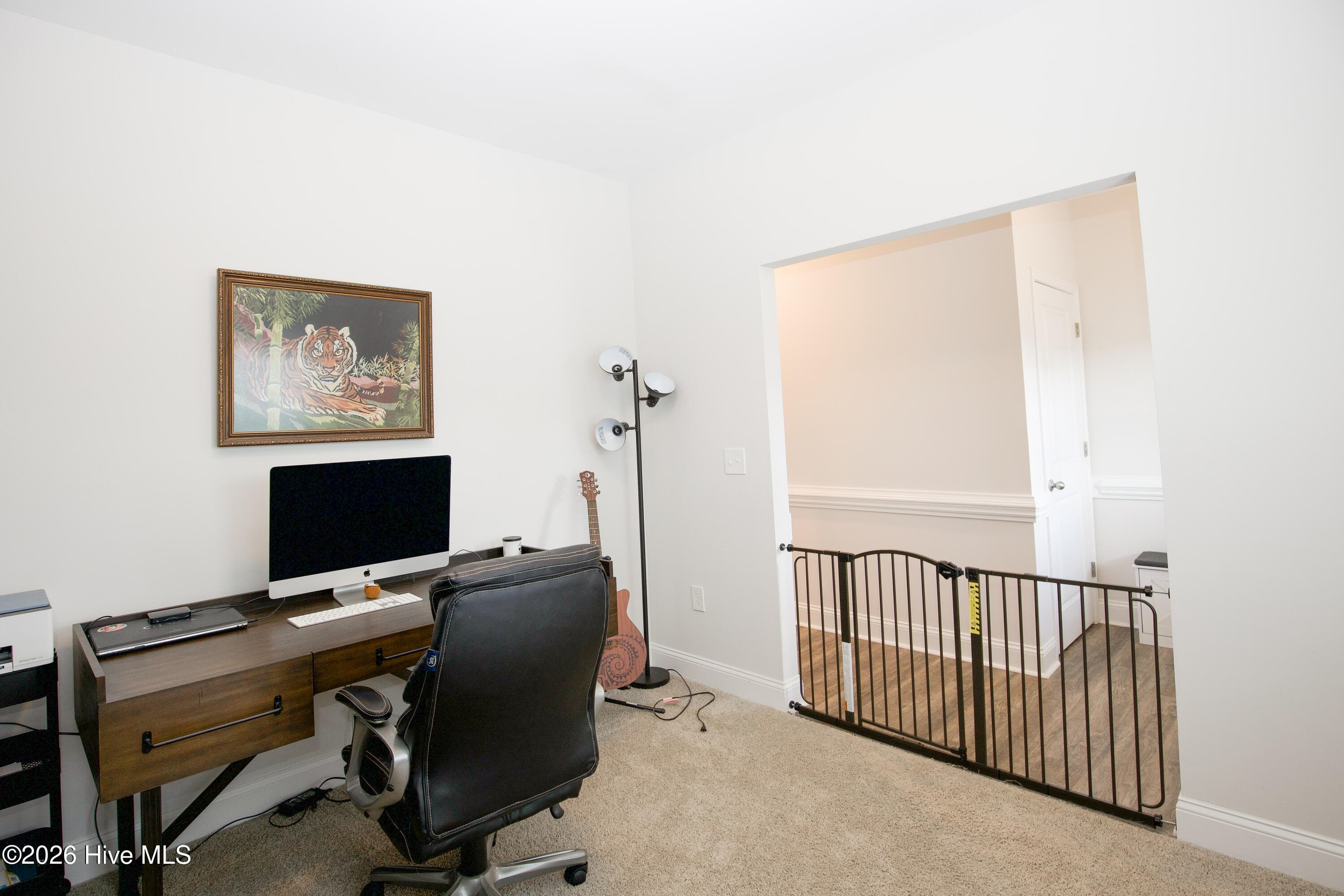With a desk set against the side wall, the flex room has room for a full workstation along with storage and seating. The opening to the front hall keeps the space easy to reach from the entry. For anyone working remotely, a dedicated room on the main level can make the workday easier to manage. - 221 Vega Lane, Linden, NC 28356