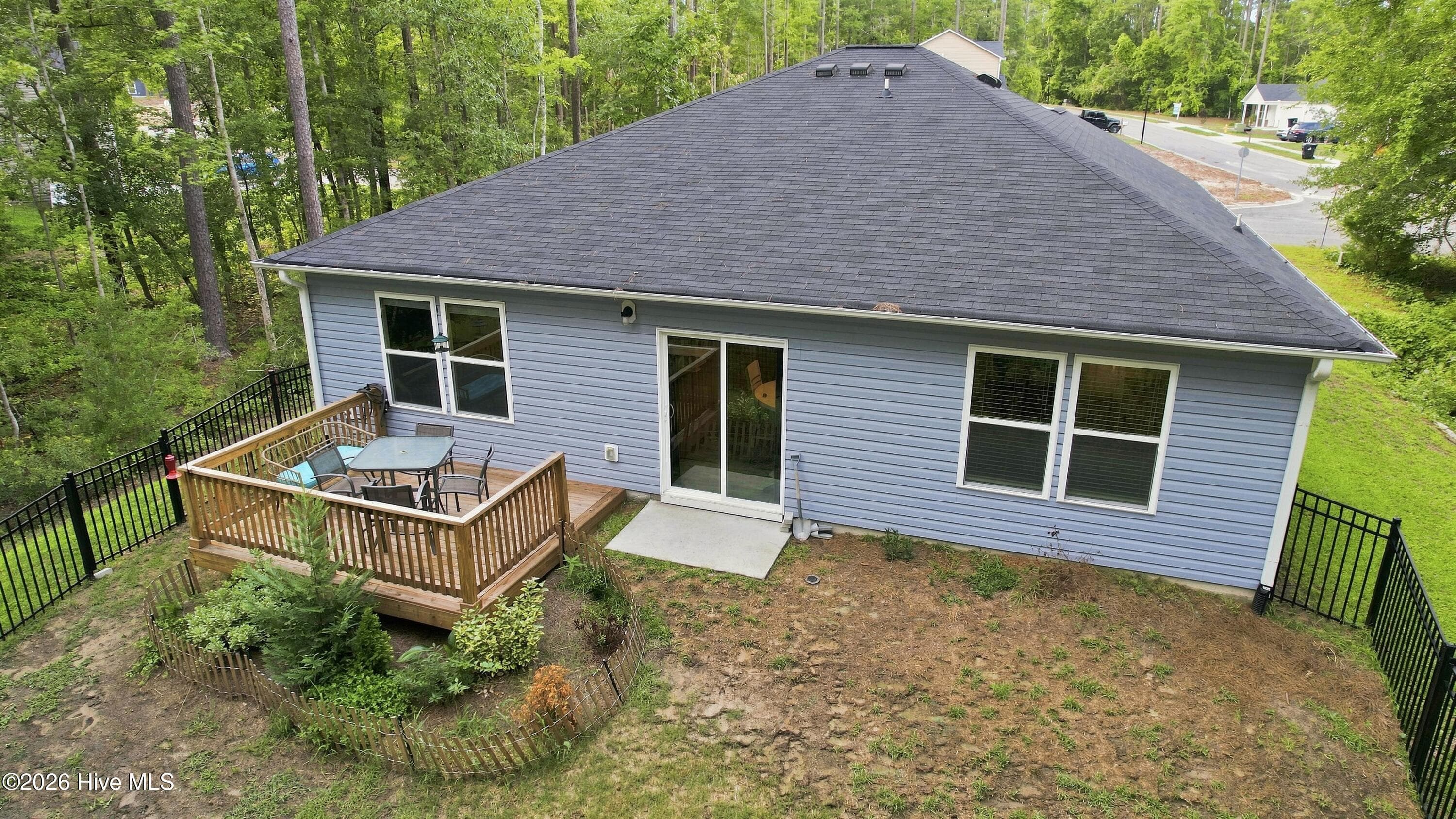 BACK OF HOUSE WITH FENCING AND DECK - 2519 Sendero Drive SE, Bolivia, NC 28422