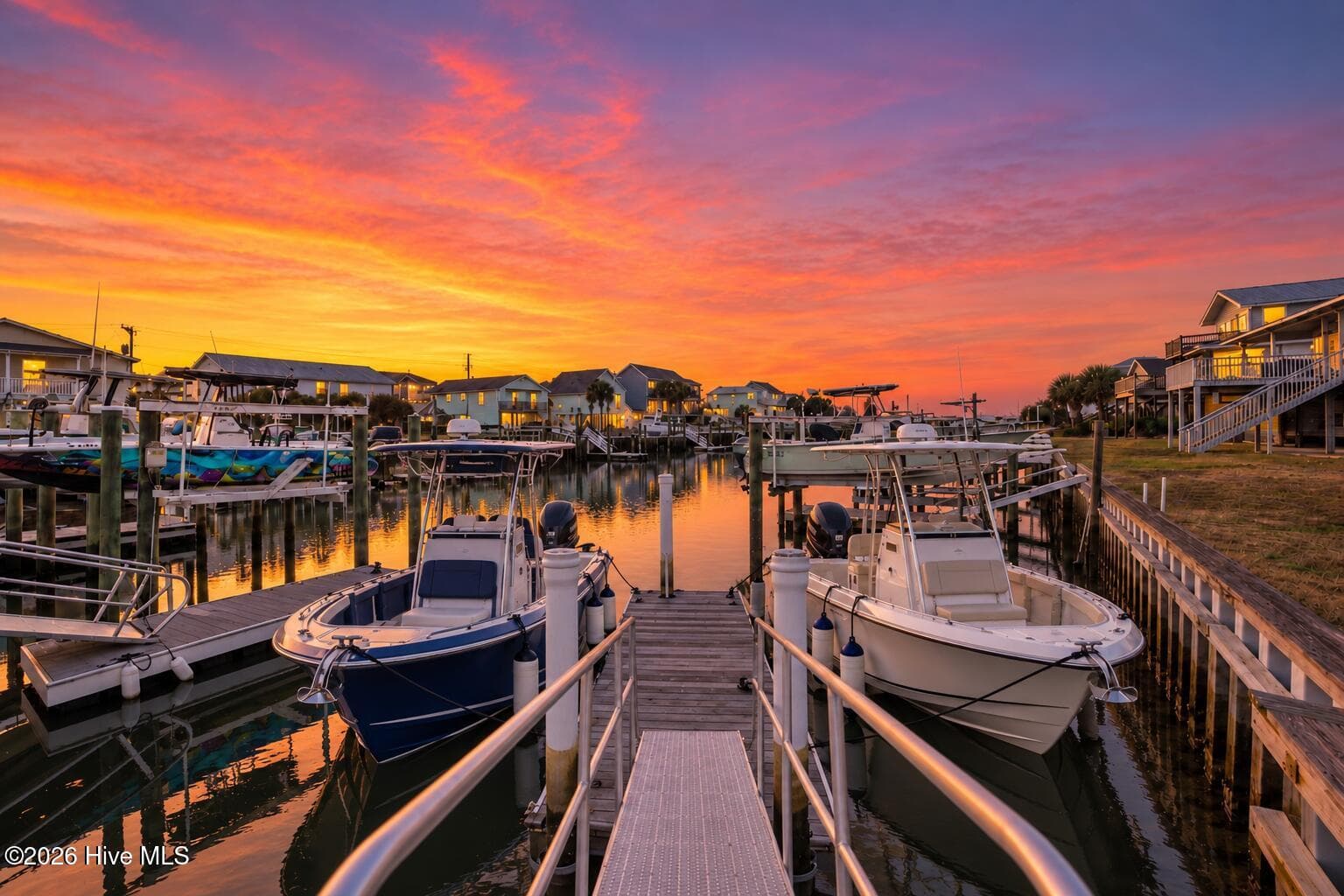 Boats shown in dock photo are AI-generated for illustrative purposes. Dock is capable of accommodating multiple boats. - 103 Mcleod Avenue, Topsail Beach, NC 28445