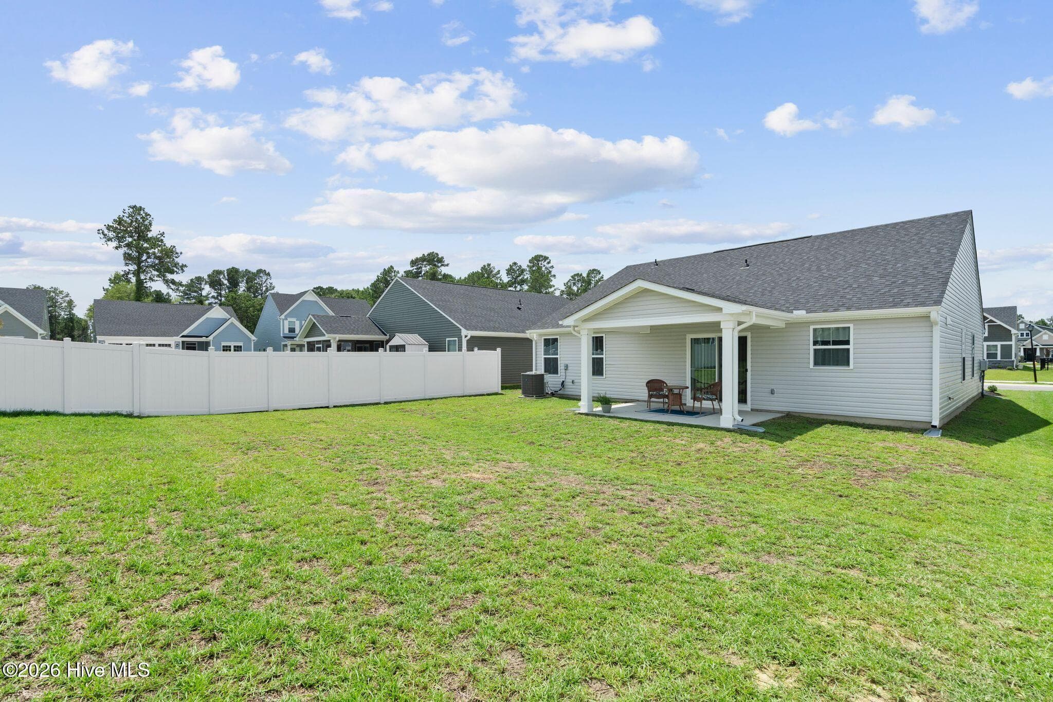 BACK YARD AND COVERED BACK PORCH - 967 Rindlewood Trail NE, Bolivia, NC 28422