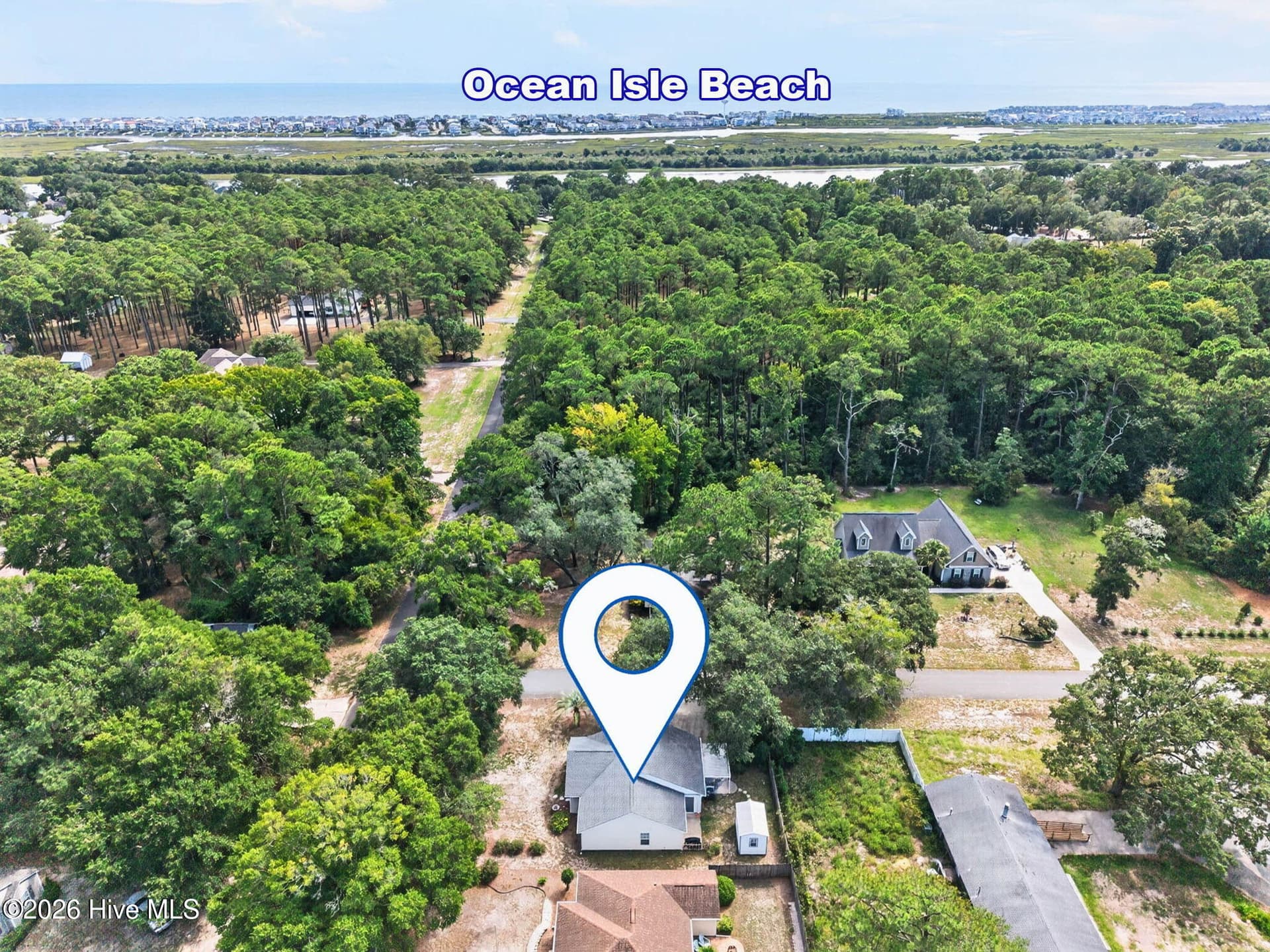 Aerial perspective showcases the home's close proximity to the island and beaches of Ocean Isle Beach, NC. - 1650 Frink Street SW, Ocean Isle Beach, NC 28469