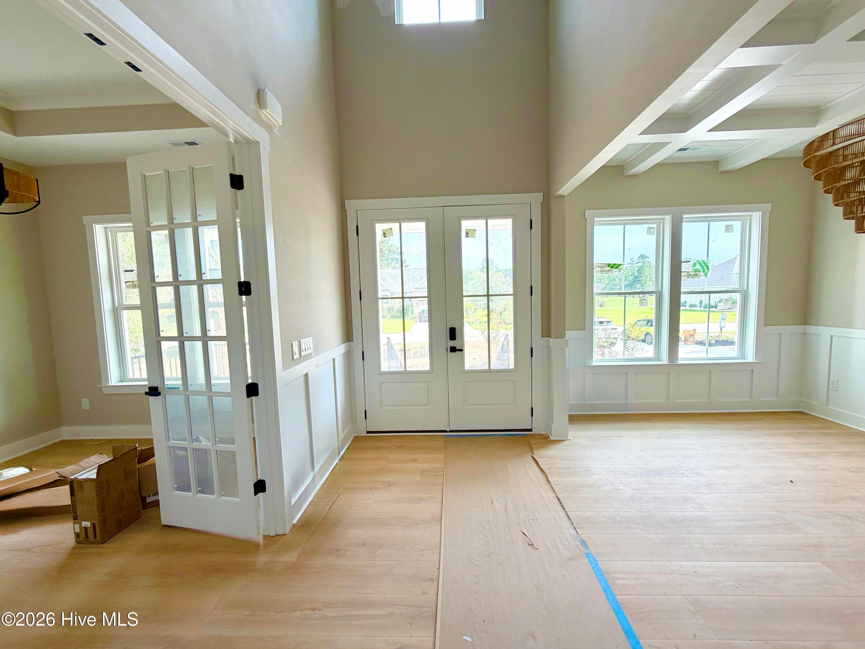 Front entryway, under construction. Looking toward front door, office is on left and dining room on right. - 550 Glenburnie Street NW, Calabash, NC 28467